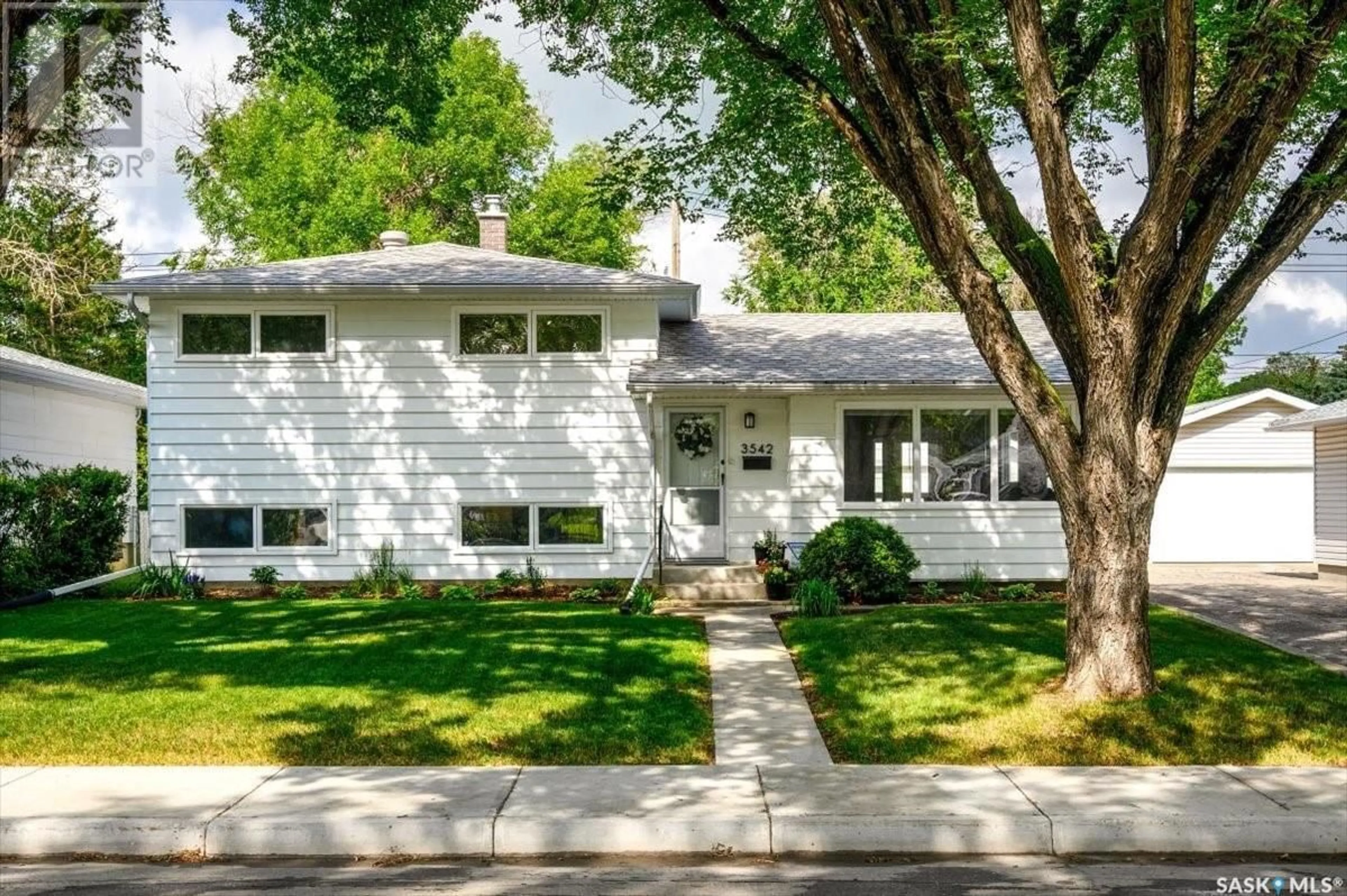Home with vinyl exterior material, street for 3542 QUEEN STREET, Regina Saskatchewan S4S2G3