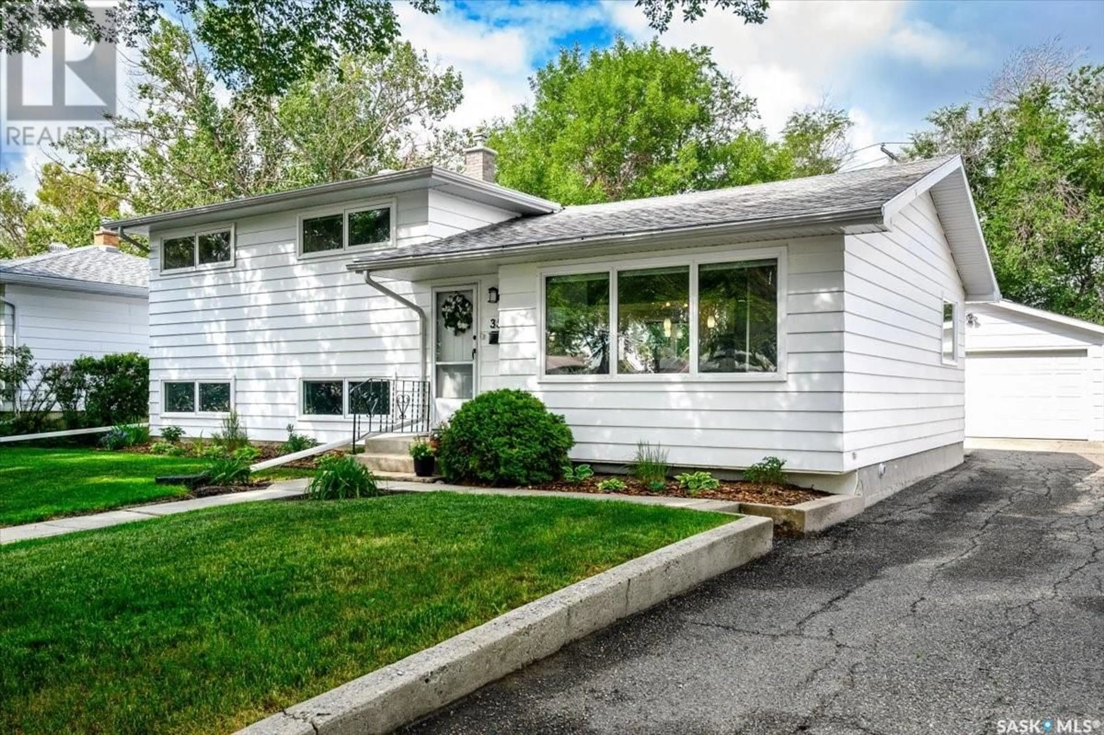 Home with vinyl exterior material, street for 3542 QUEEN STREET, Regina Saskatchewan S4S2G3