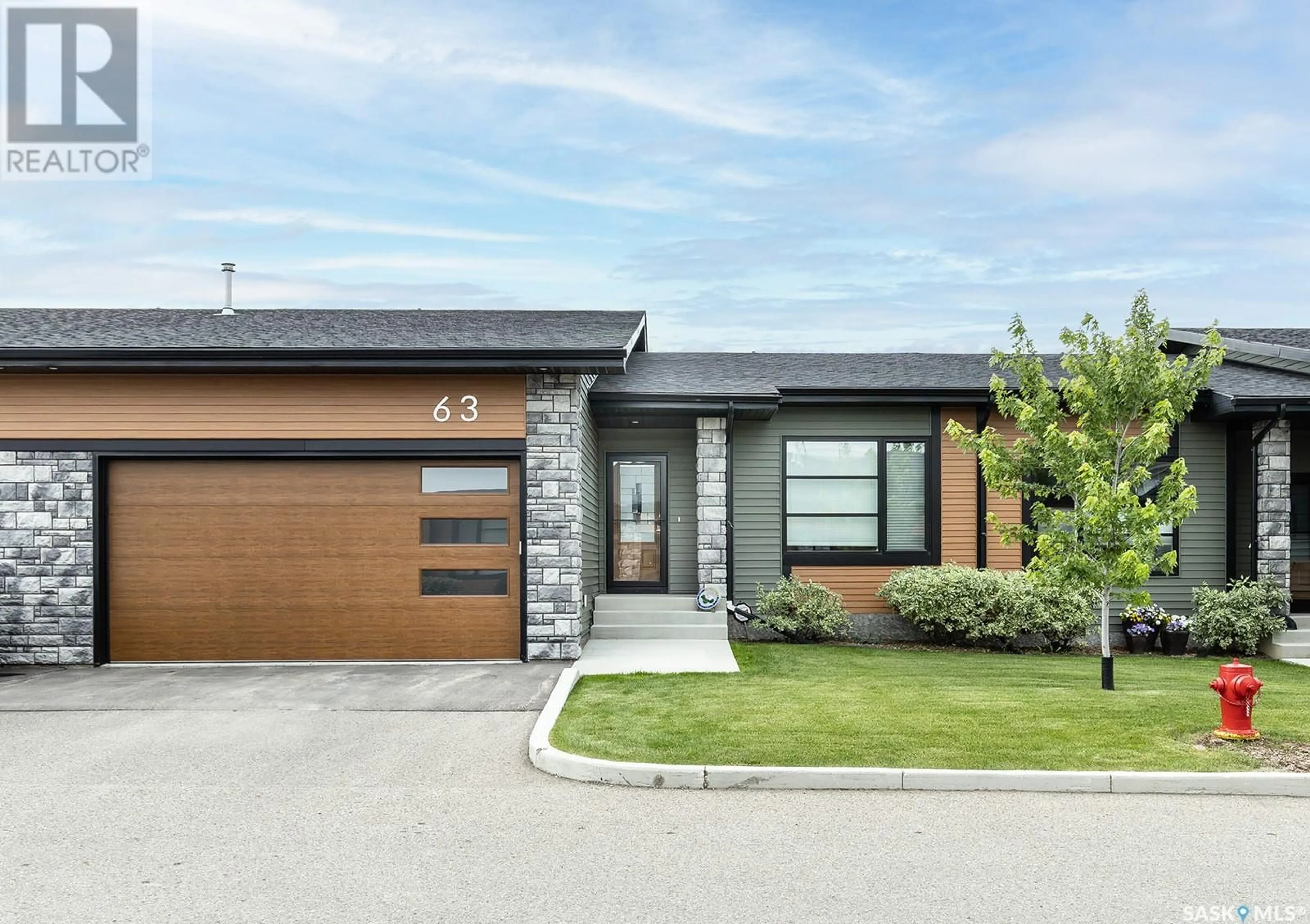Home with brick exterior material, street for 103 - 63 POHORECKY CRESCENT, Saskatoon Saskatchewan S7W0X7