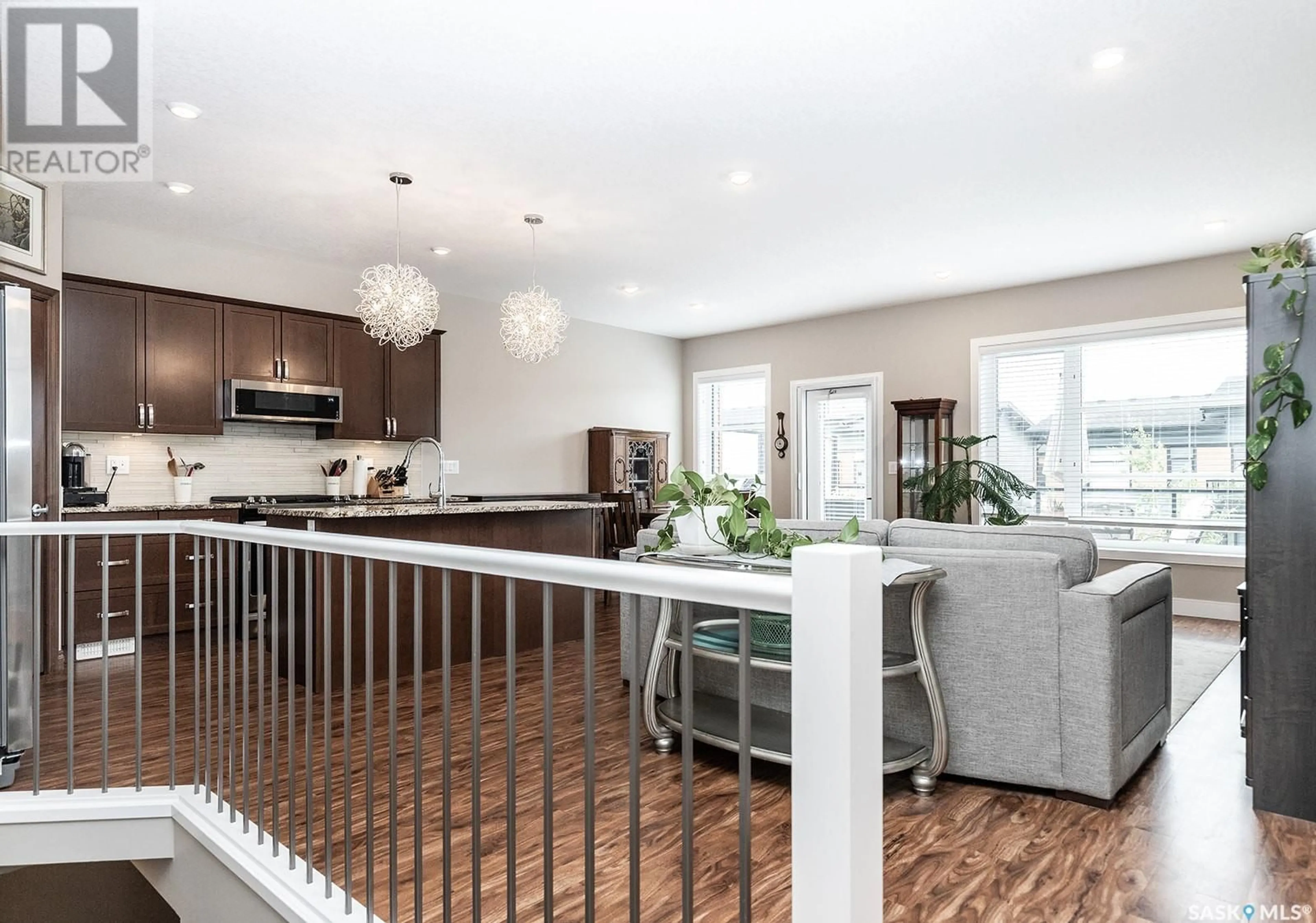 Open concept kitchen, wood/laminate floor for 103 - 63 POHORECKY CRESCENT, Saskatoon Saskatchewan S7W0X7