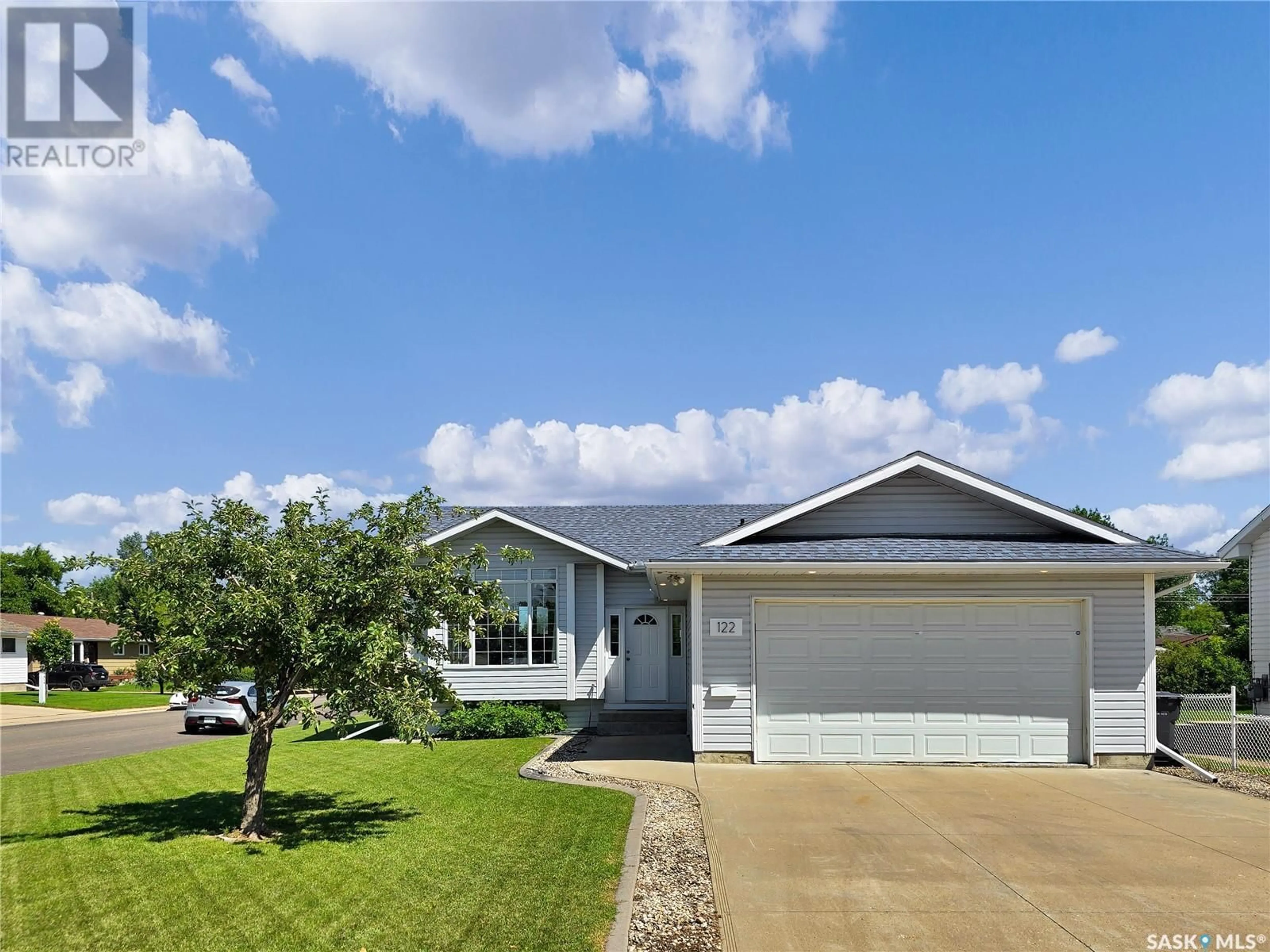 Home with vinyl exterior material, street for 122 7TH AVENUE, Warman Saskatchewan S0K4S0