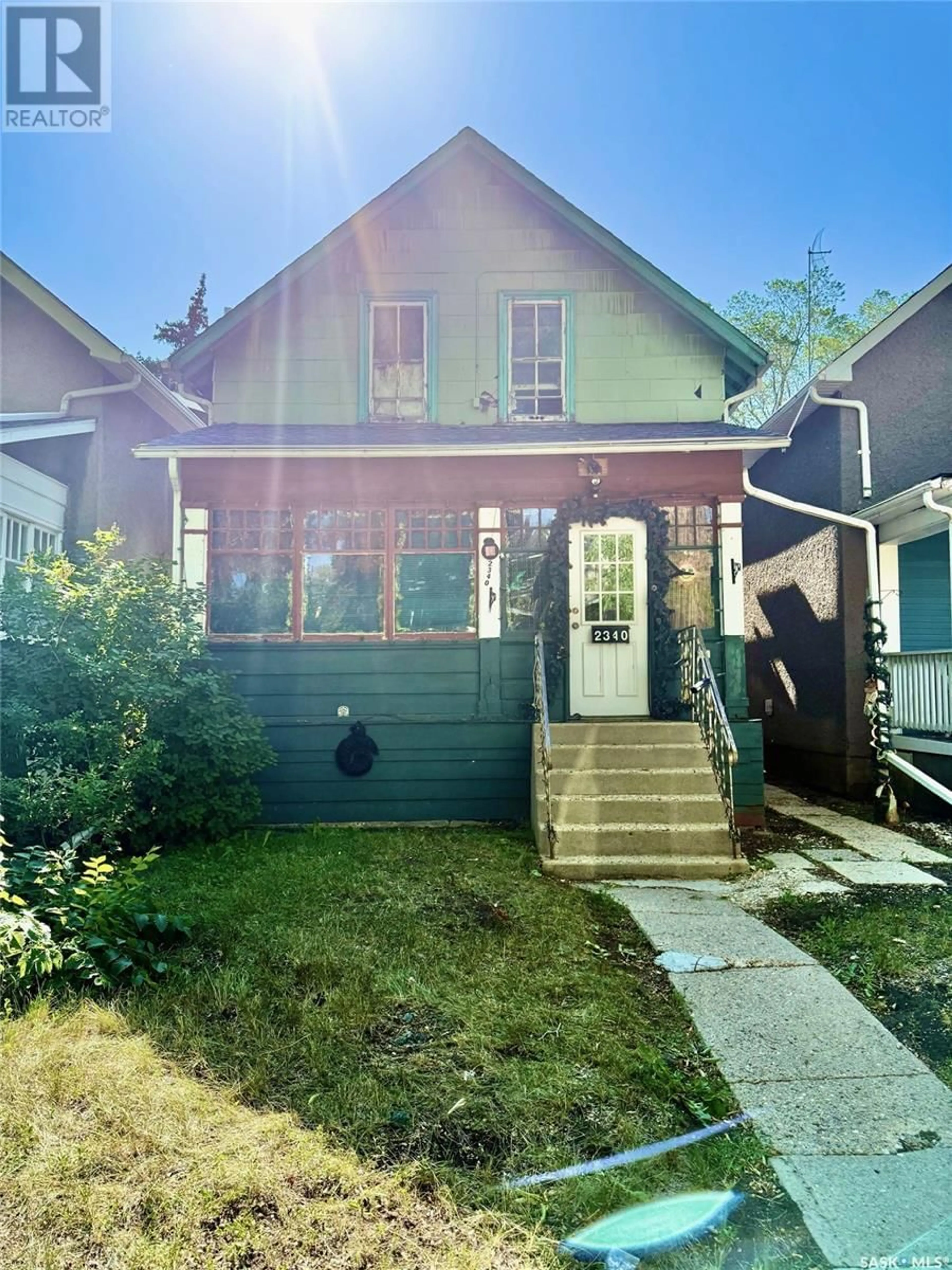 Home with vinyl exterior material, street for 2340 TORONTO STREET, Regina Saskatchewan S4P1N6