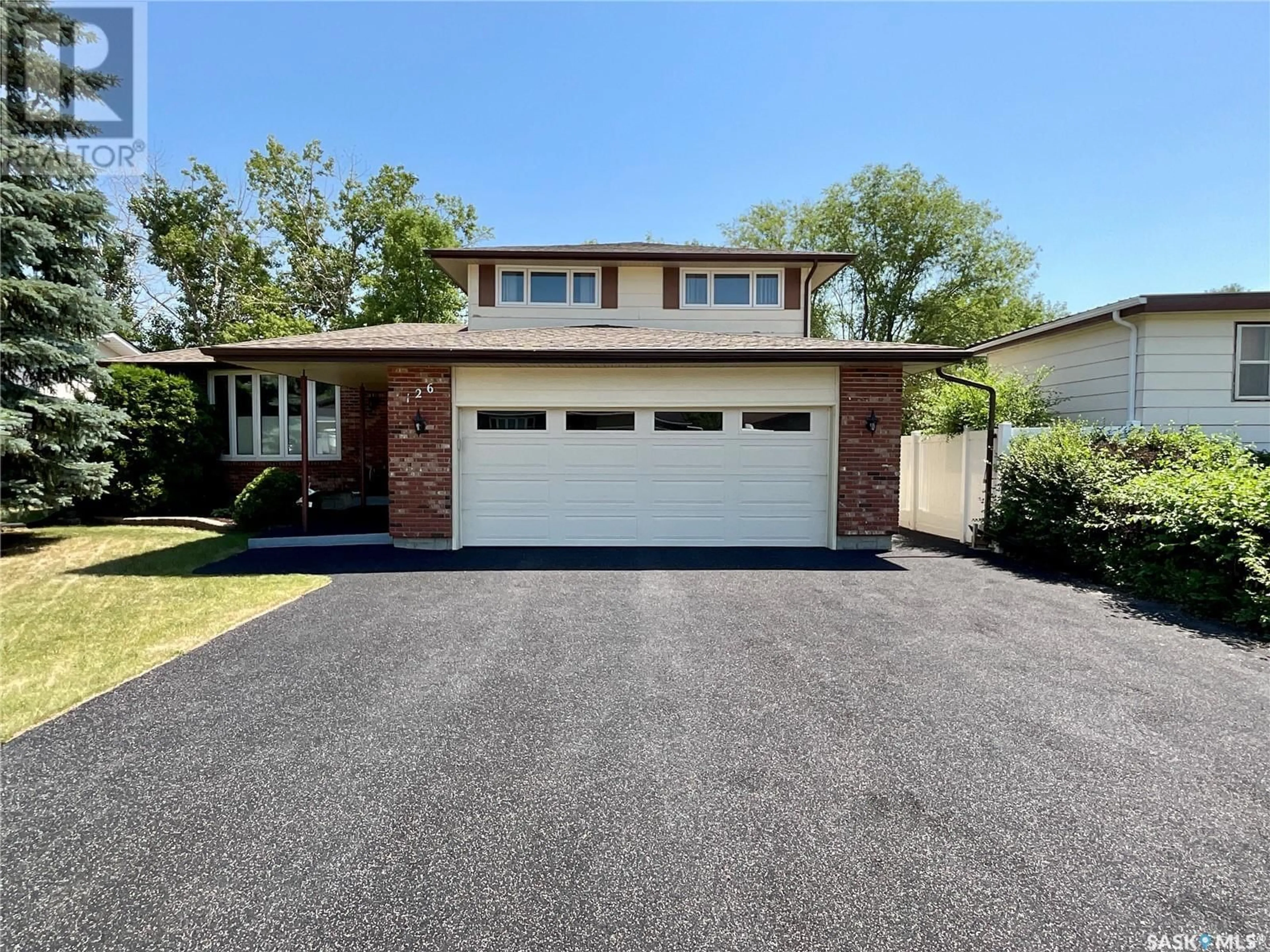 Home with brick exterior material, street for 126 HAWKES BAY, Regina Saskatchewan S4X1G7