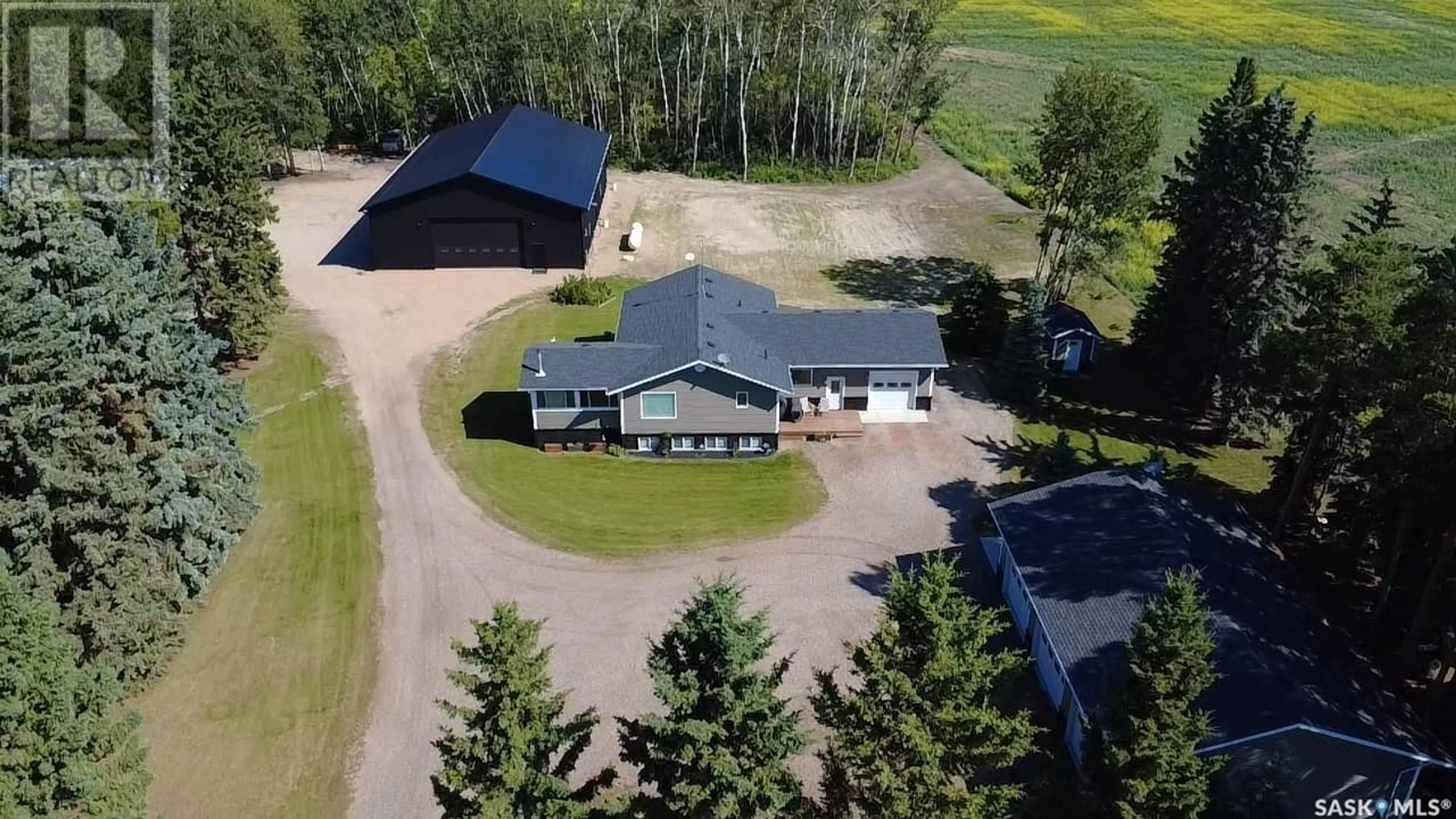 A pic from outside/outdoor area/front of a property/back of a property/a pic from drone, building for TLUCHAK ACREAGE, Willow Creek Rm No. 458 Saskatchewan S0E0W0