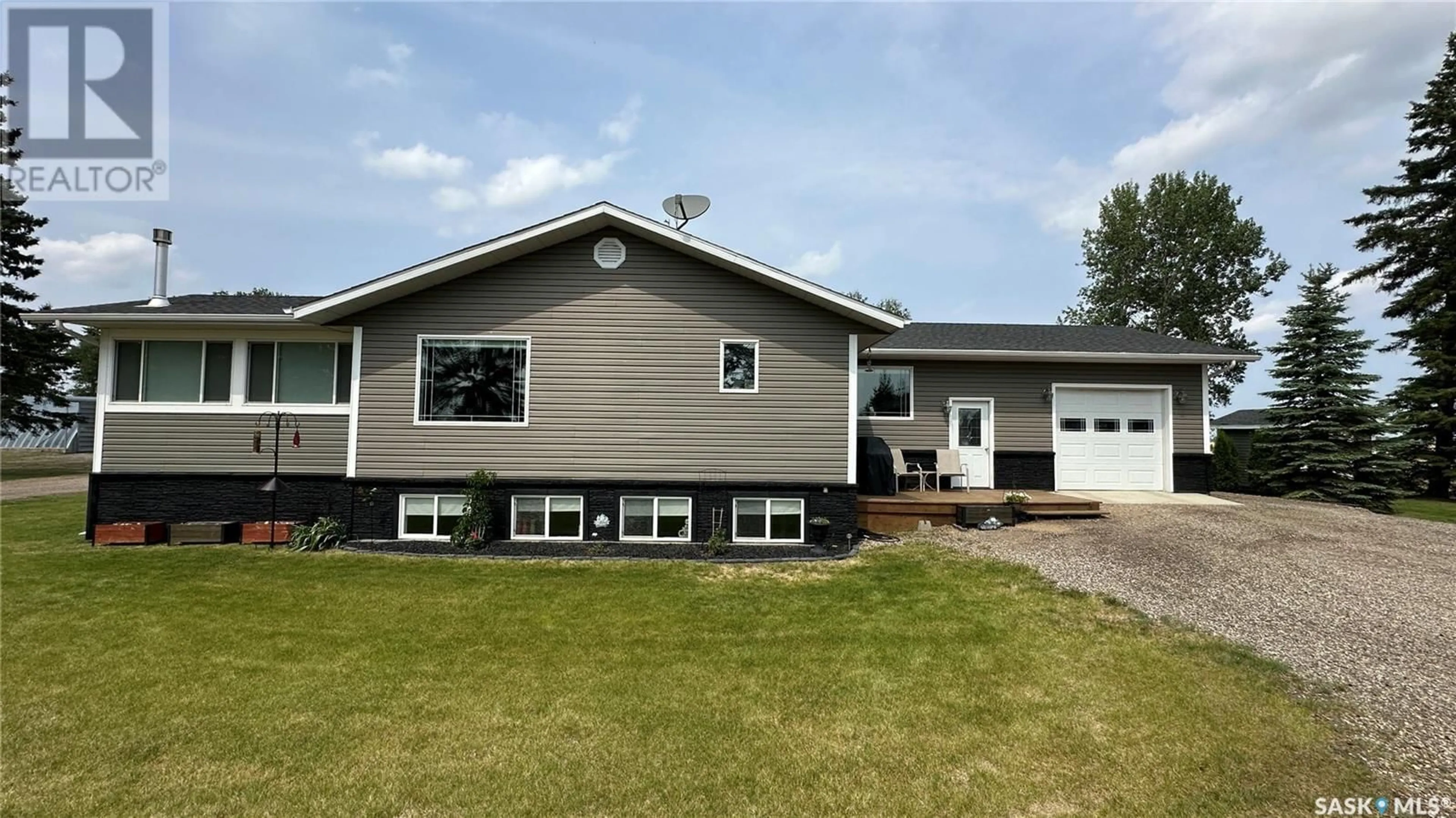 Home with vinyl exterior material, street for TLUCHAK ACREAGE, Willow Creek Rm No. 458 Saskatchewan S0E0W0