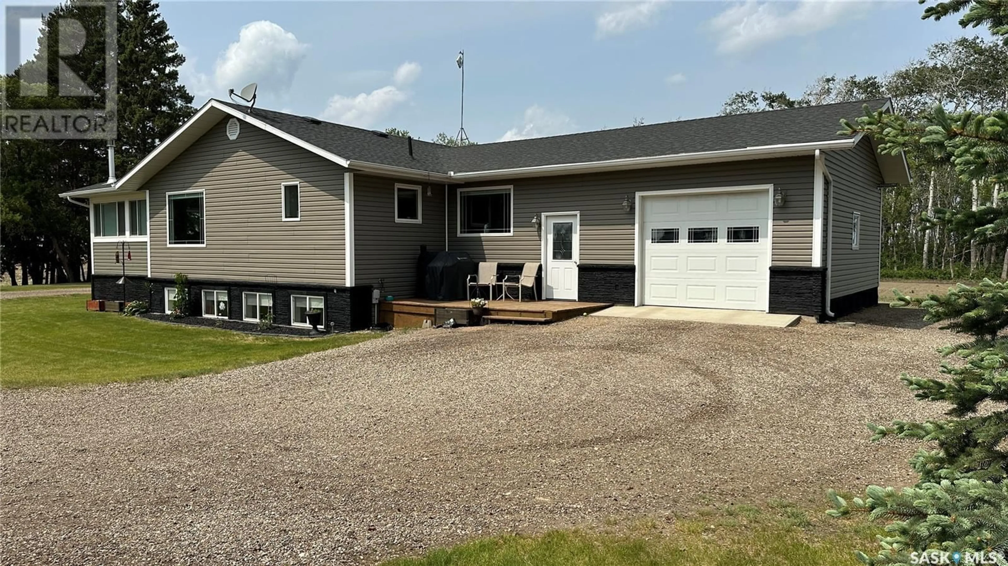 Home with vinyl exterior material, street for TLUCHAK ACREAGE, Willow Creek Rm No. 458 Saskatchewan S0E0W0