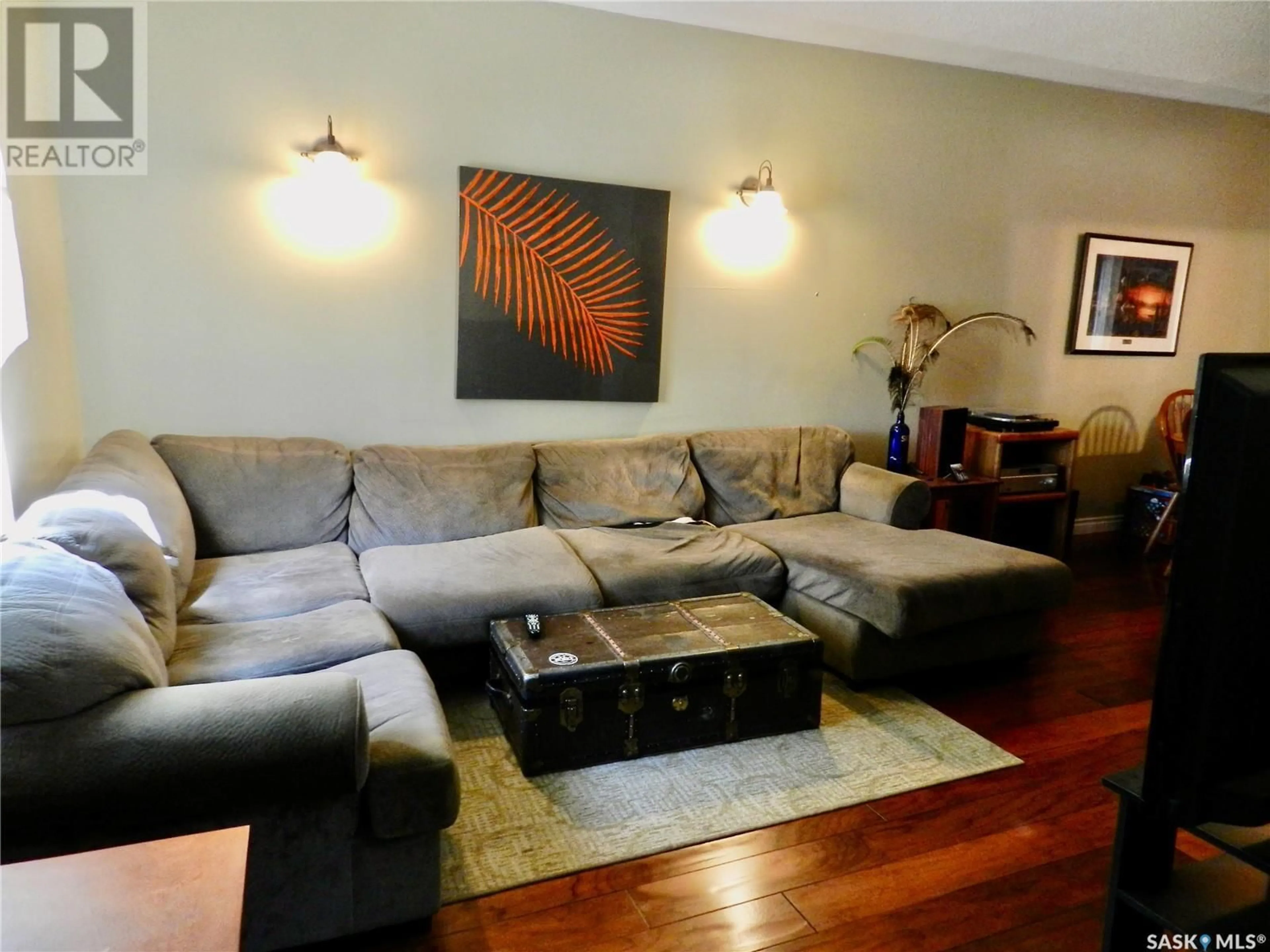 Living room with furniture, wood/laminate floor for 1121 6TH AVENUE, Moose Jaw Saskatchewan S6H4A7