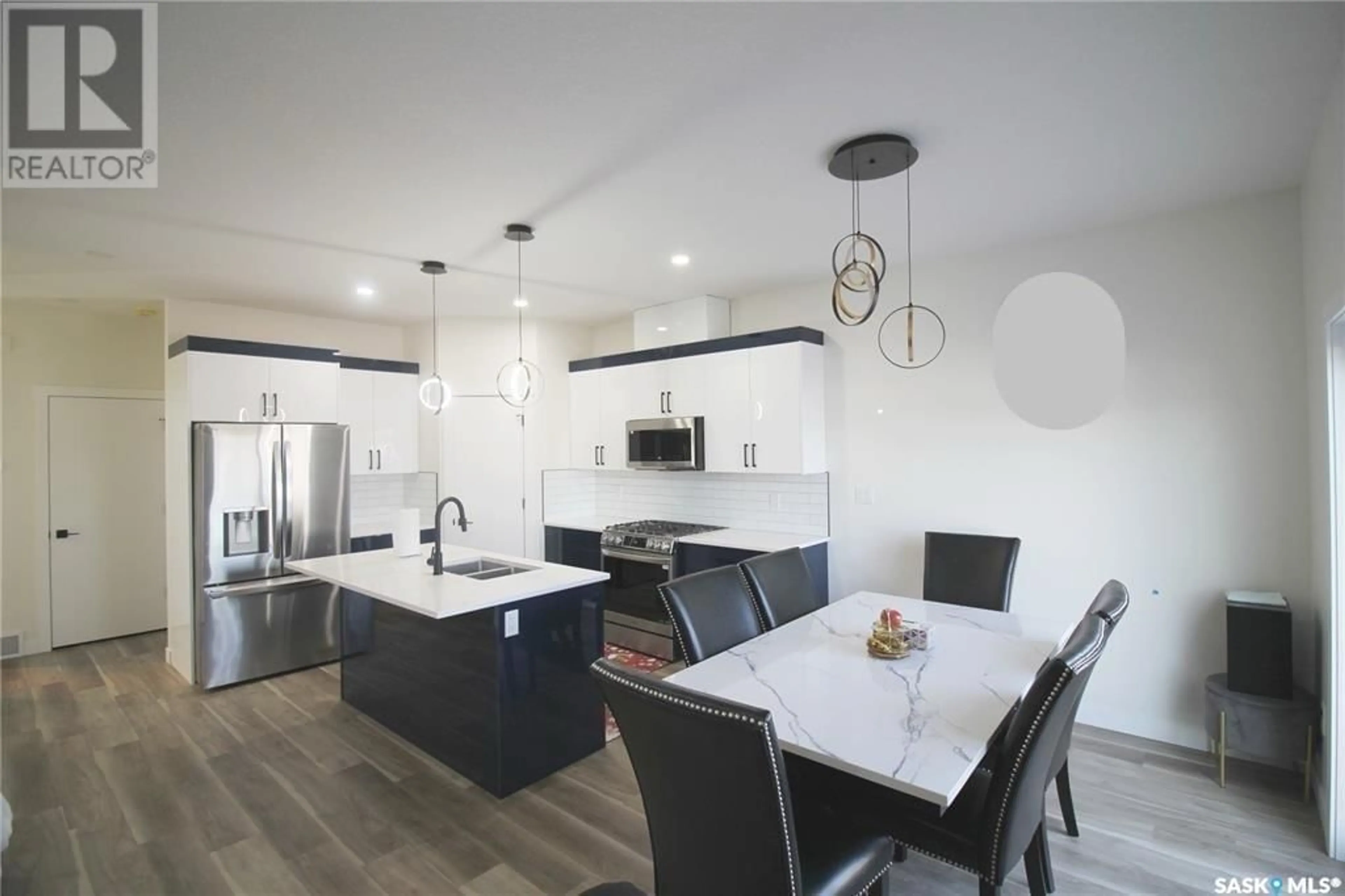 Open concept kitchen, ceramic/tile floor for 3005 DUMONT WAY, Regina Saskatchewan S4V3Z3