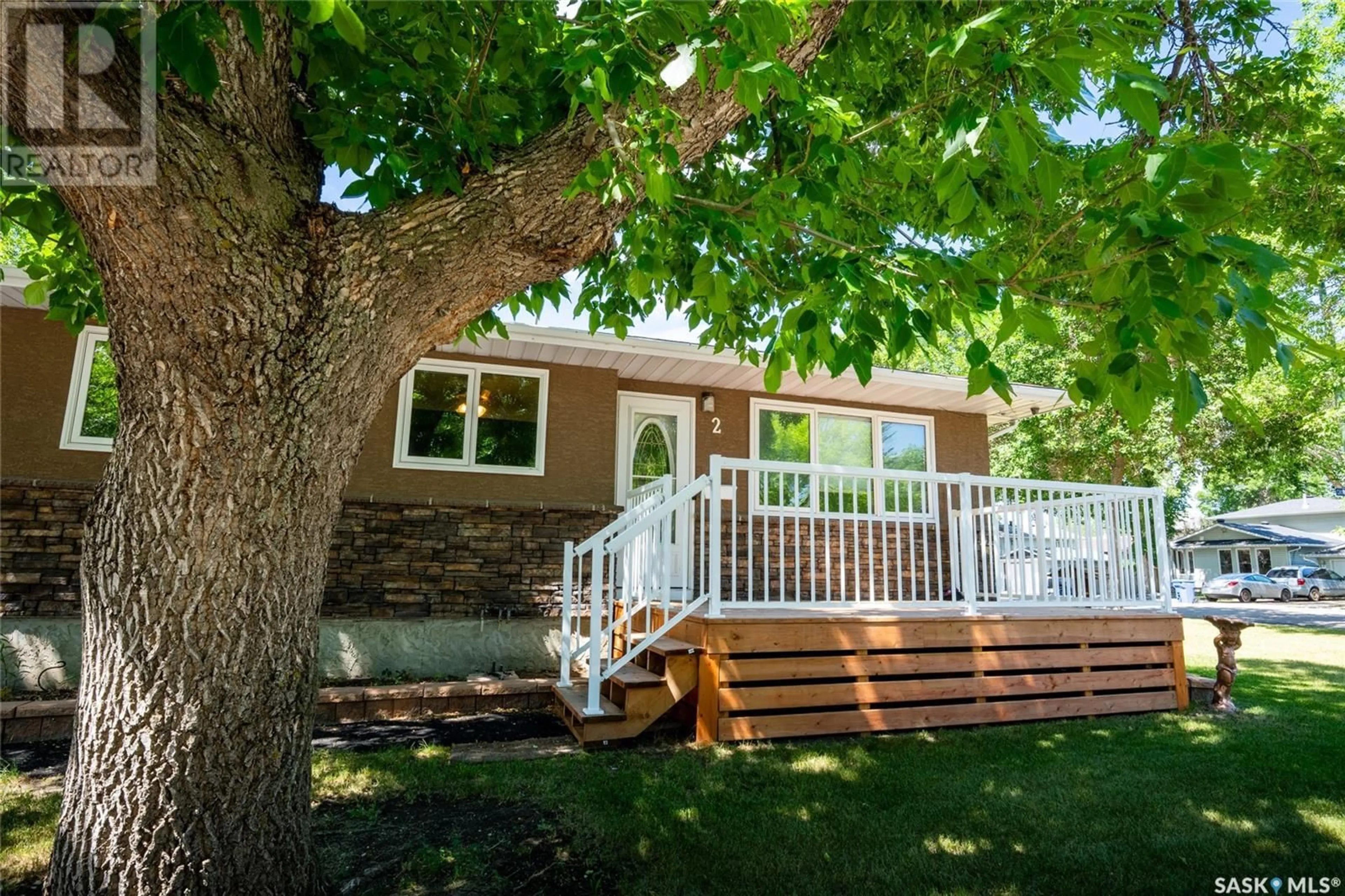 Home with vinyl exterior material, street for 2 CHURCH DRIVE, Regina Saskatchewan S4X1P6