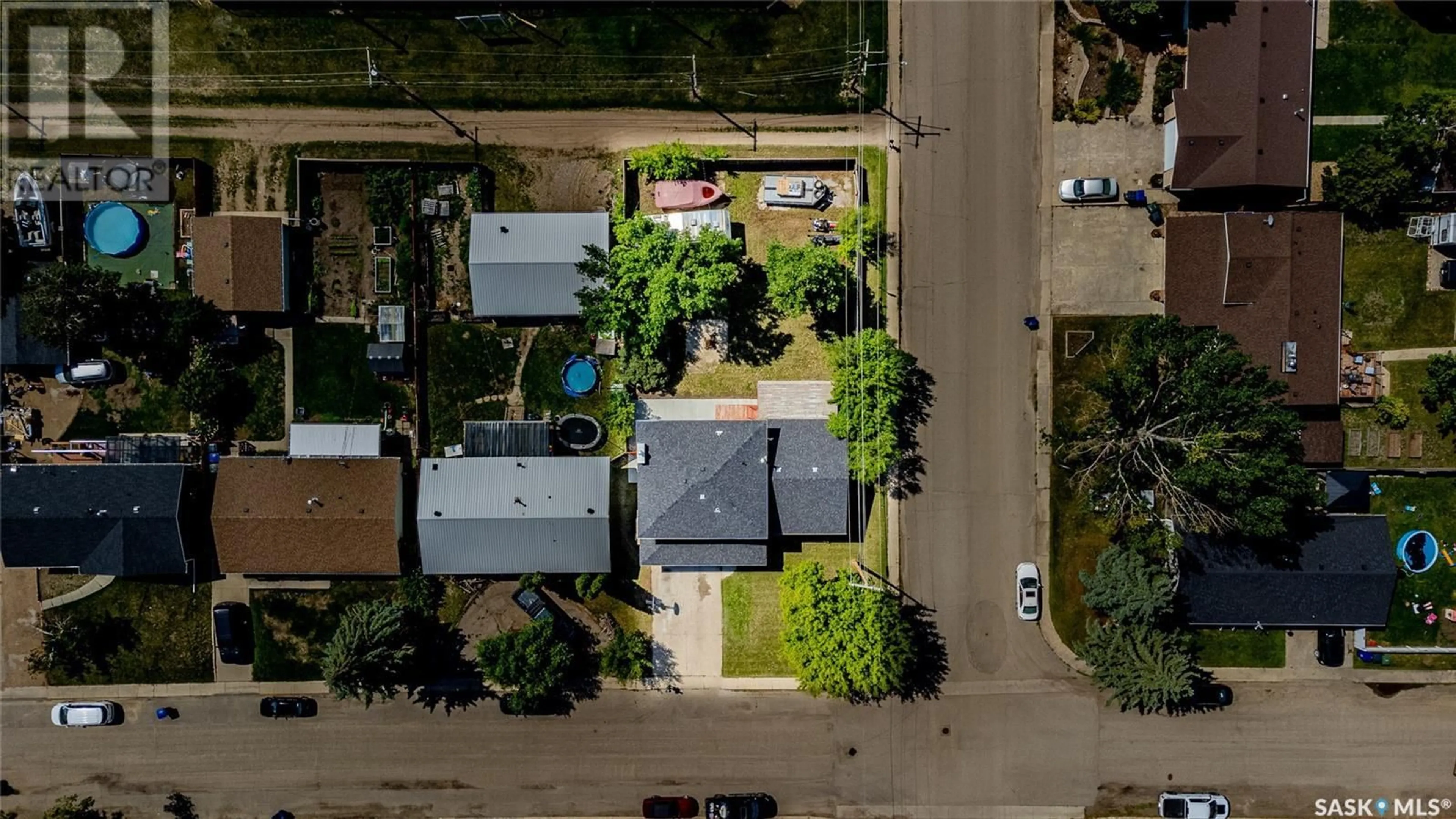 A pic from outside/outdoor area/front of a property/back of a property/a pic from drone, street for 302 4TH AVENUE, Langham Saskatchewan S0K2L0