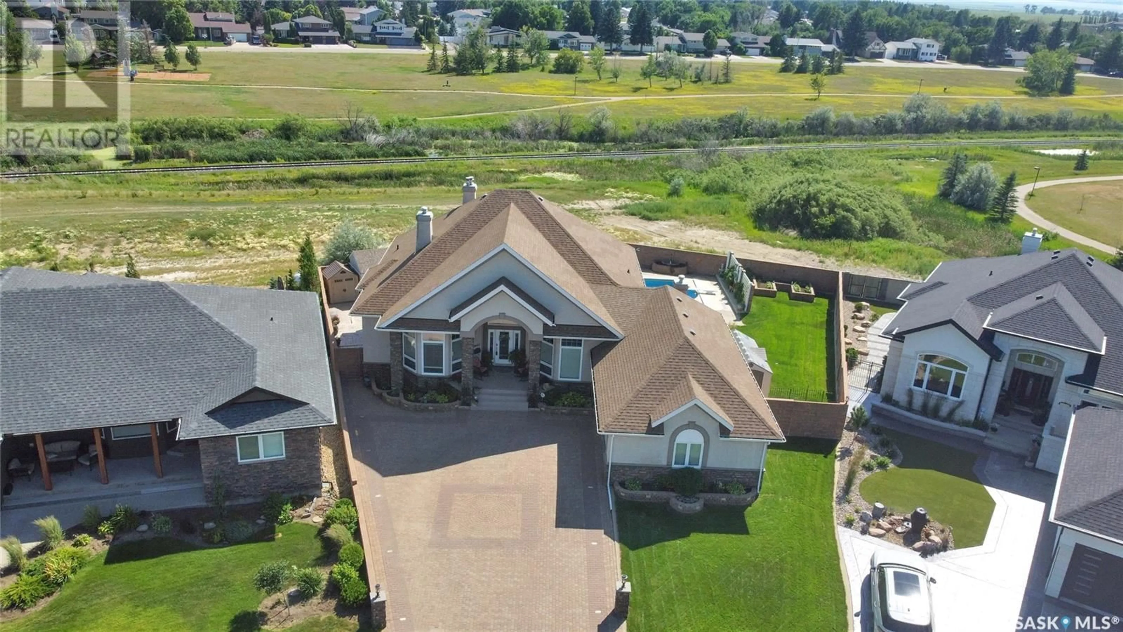 A pic from outside/outdoor area/front of a property/back of a property/a pic from drone, mountain view for 1453 NORMANDY DRIVE, Moose Jaw Saskatchewan S6H6P1