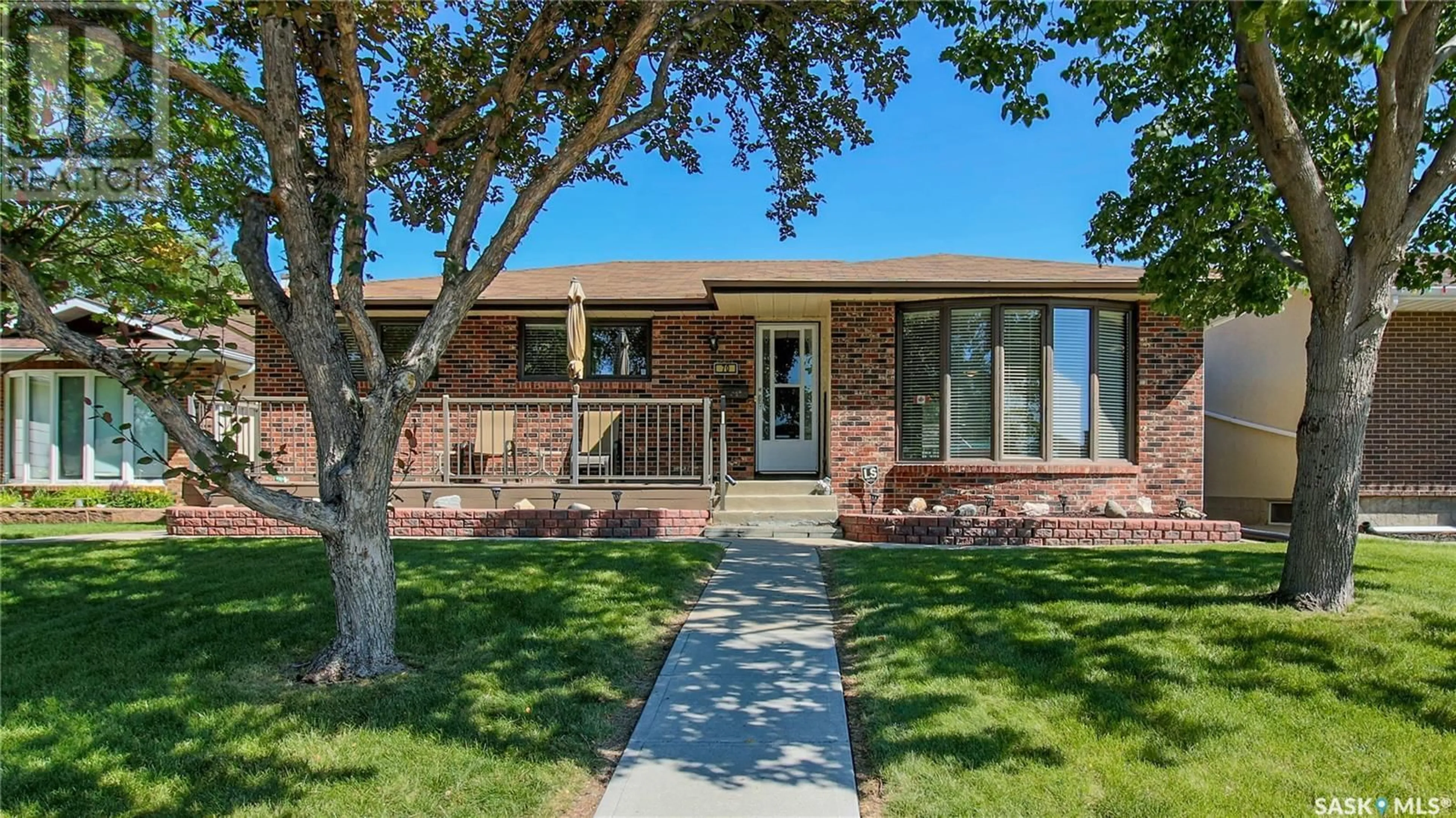 Home with brick exterior material, street for 70 HAWKES AVENUE, Regina Saskatchewan S4X1B4