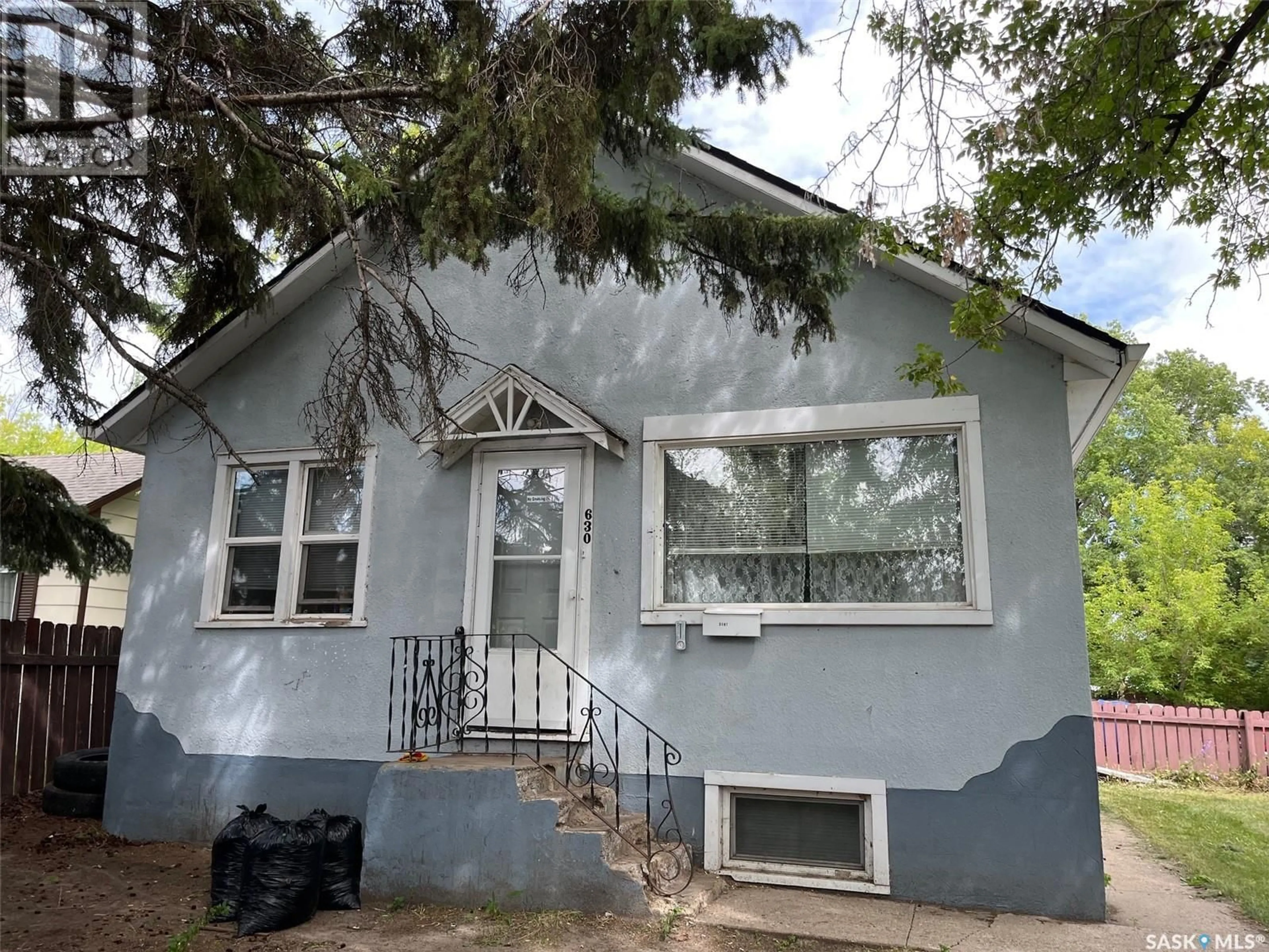 Home with vinyl exterior material, street for E - 630 5TH AVENUE, Prince Albert Saskatchewan S6V2H5