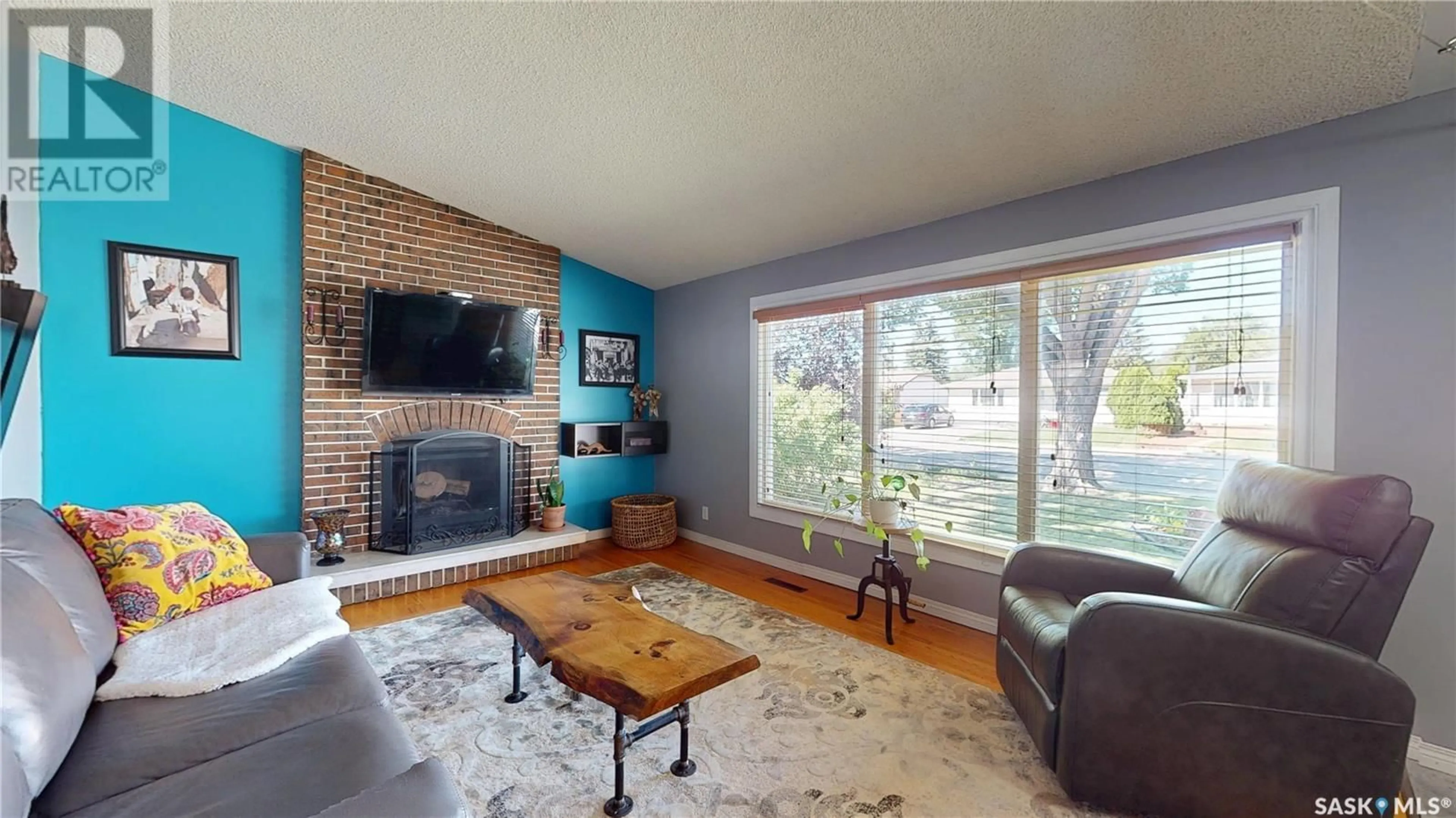 Living room with furniture, unknown for 102 MCINNIS CRESCENT, Regina Saskatchewan S4R3E8