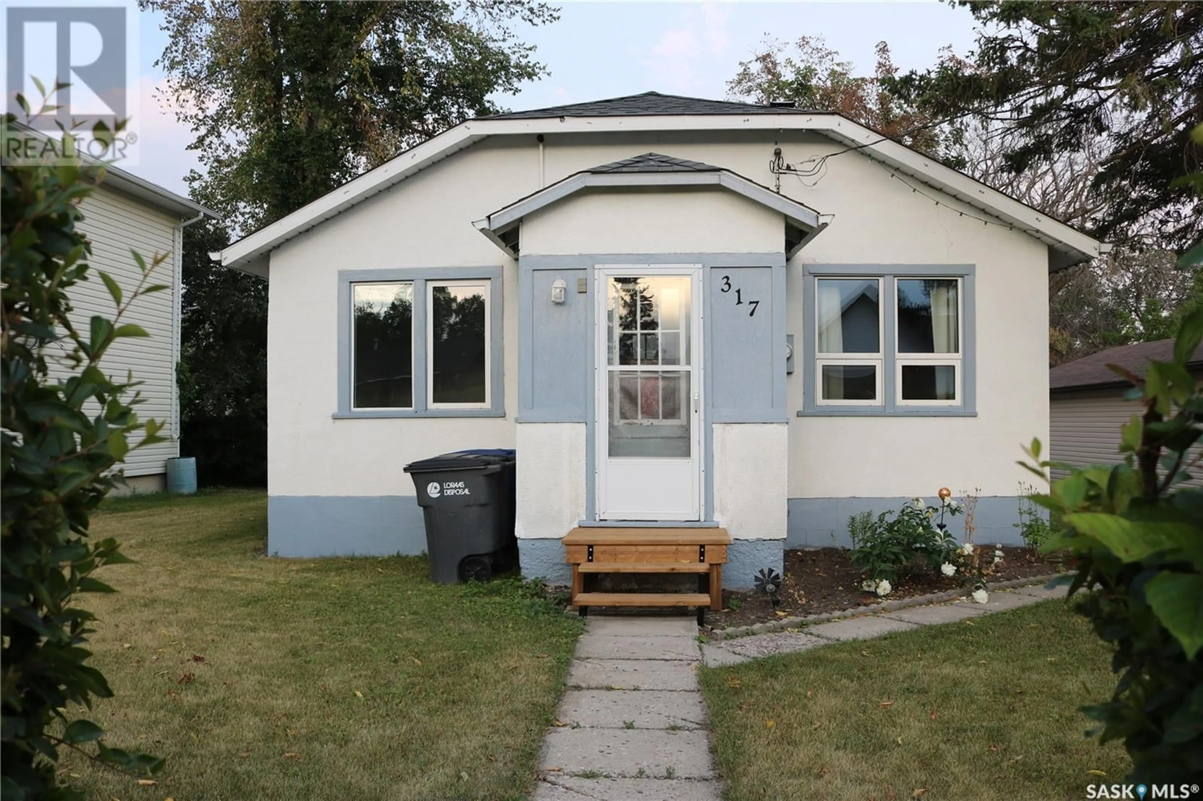 Home with vinyl exterior material, street for 317 4TH AVENUE, Wapella Saskatchewan S0G4Z0