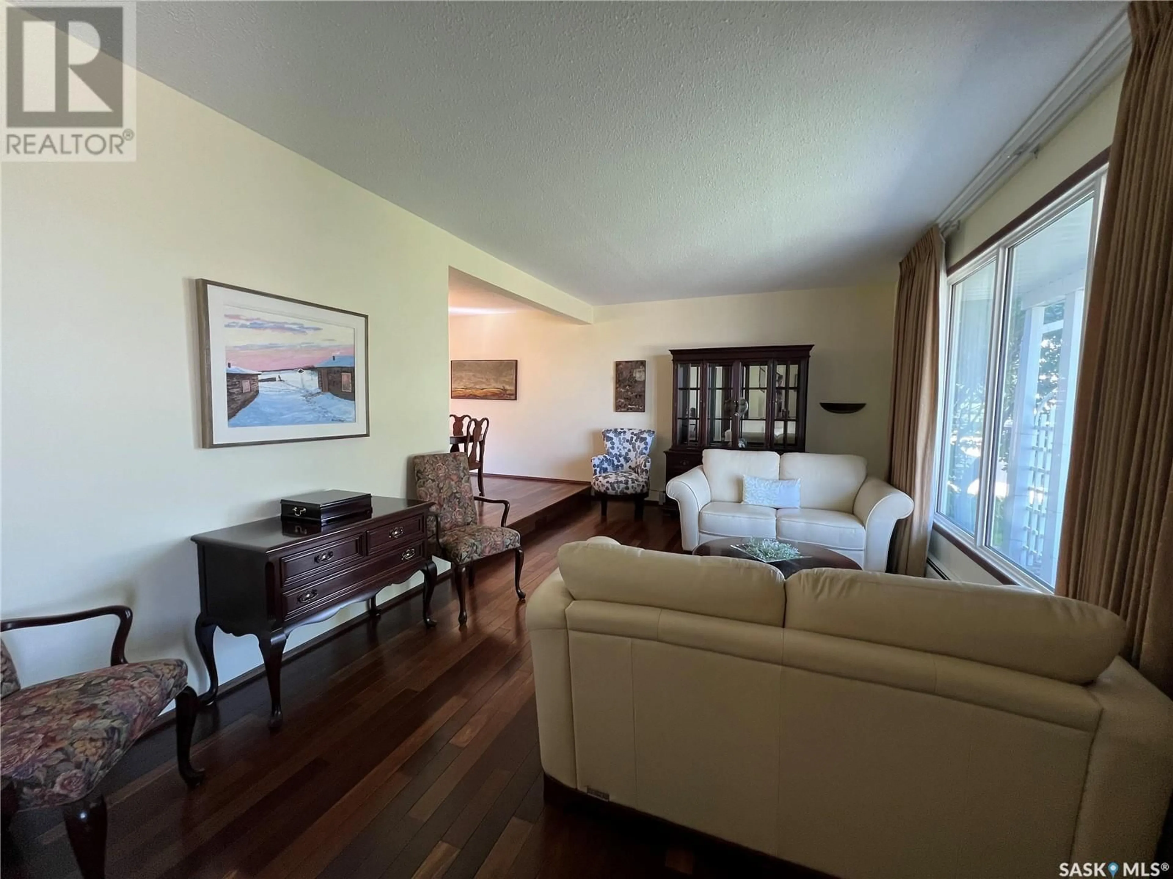 Living room with furniture, wood/laminate floor for 270 BATTLEFORD TRAIL, Swift Current Saskatchewan S9H4J5
