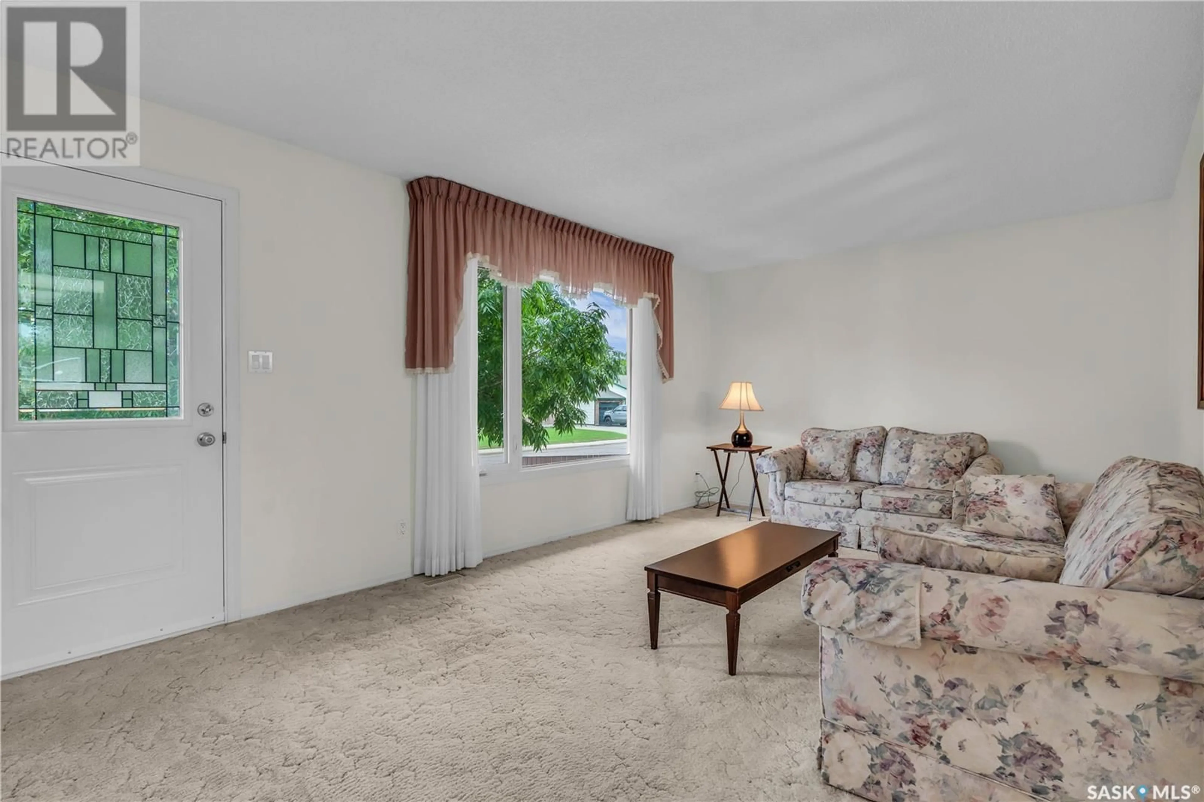 Living room with furniture, carpet floor for 9025 ABBOTT AVENUE, North Battleford Saskatchewan S9A3H7