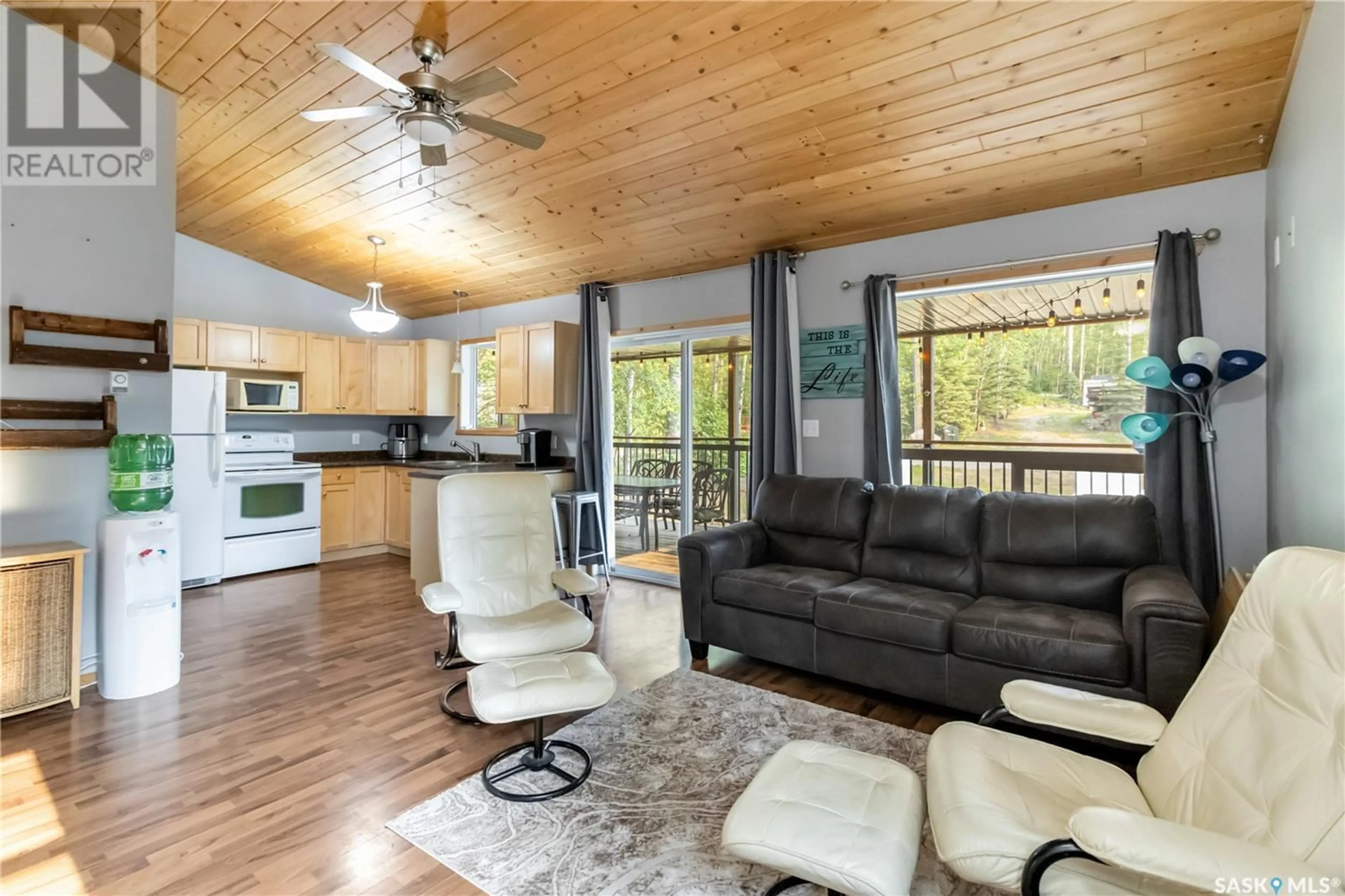 Living room with furniture, wood/laminate floor for 71 150 OKEMA BEACH ROAD, Lakeland Rm No. 521 Saskatchewan S0J0N0