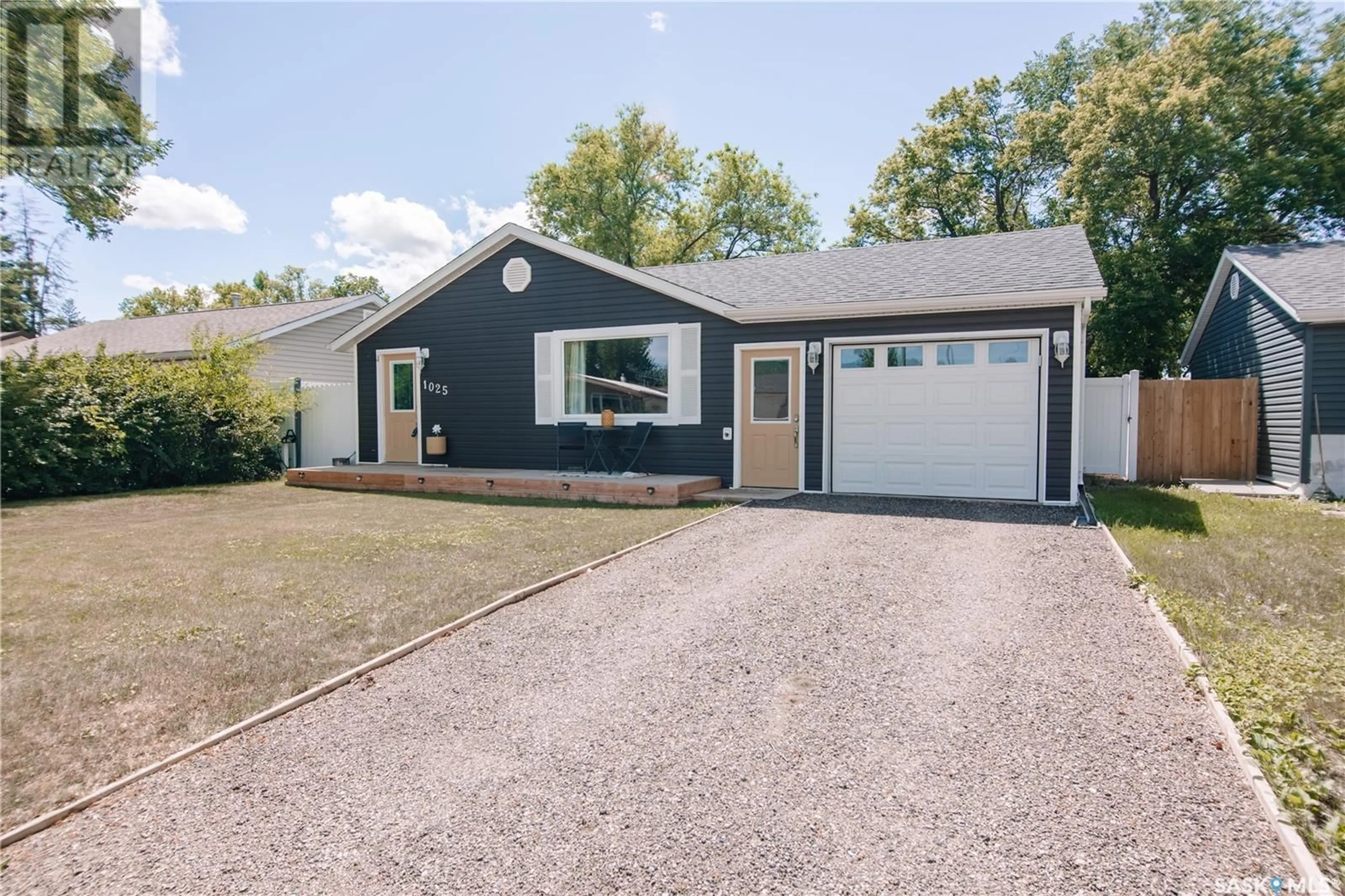 Home with vinyl exterior material, street for 1025 BROWN STREET, Moose Jaw Saskatchewan S6H2Z4