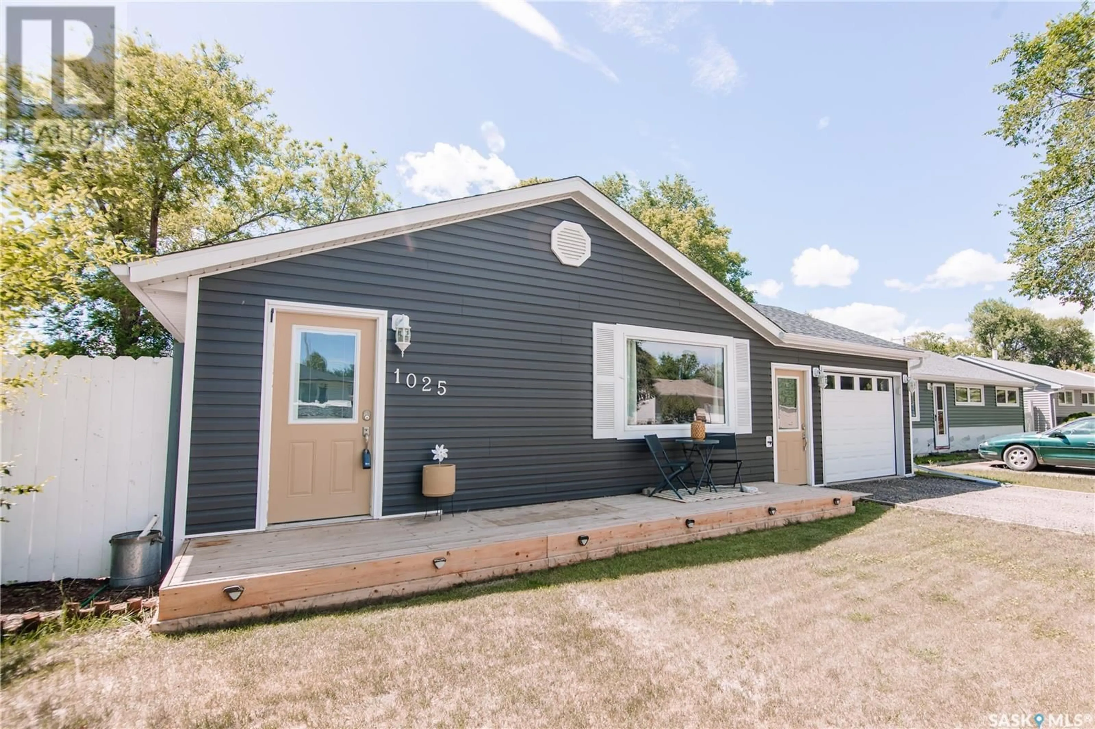 Home with vinyl exterior material, street for 1025 BROWN STREET, Moose Jaw Saskatchewan S6H2Z4
