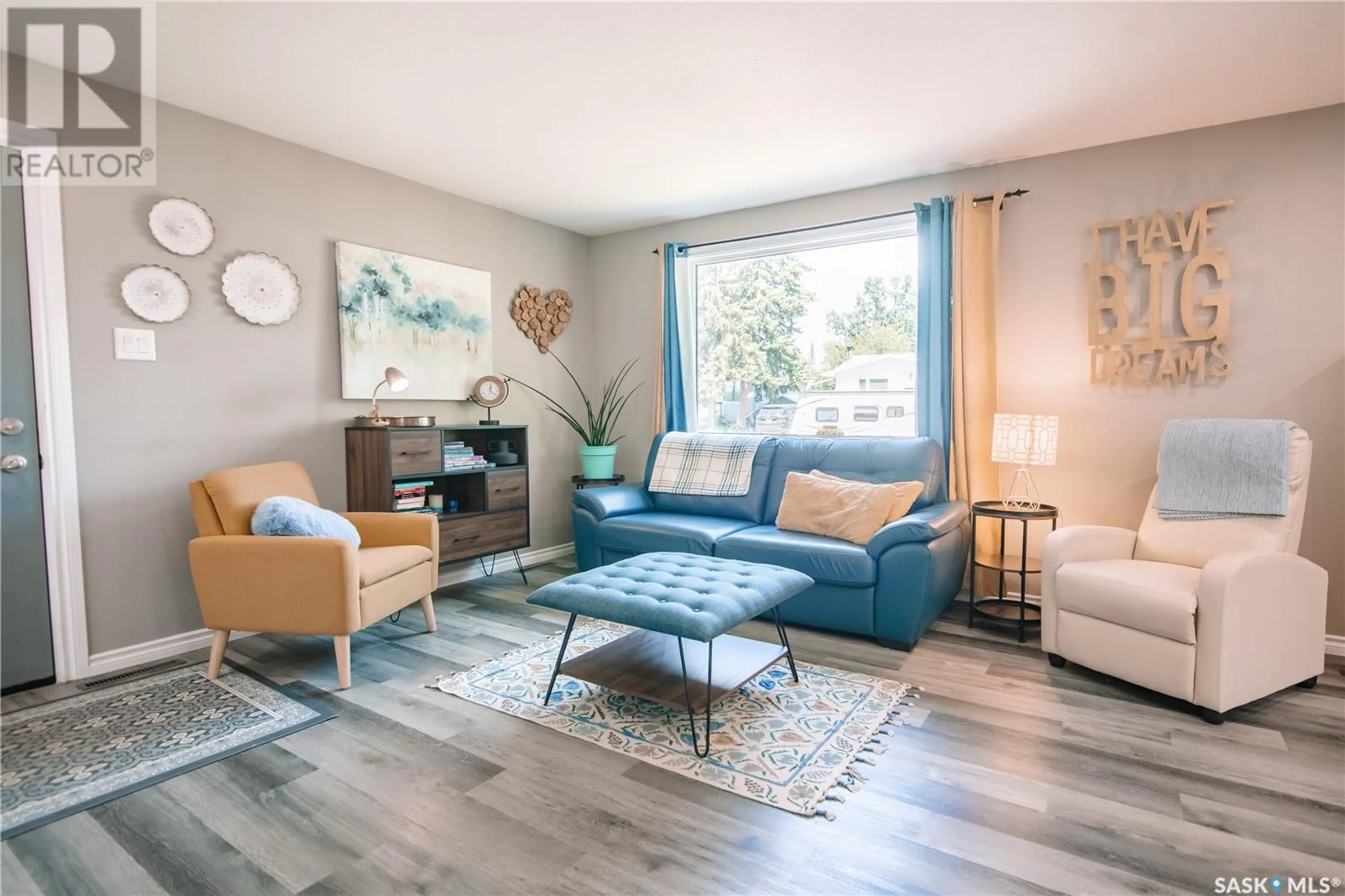 Living room with furniture, wood/laminate floor for 1025 BROWN STREET, Moose Jaw Saskatchewan S6H2Z4