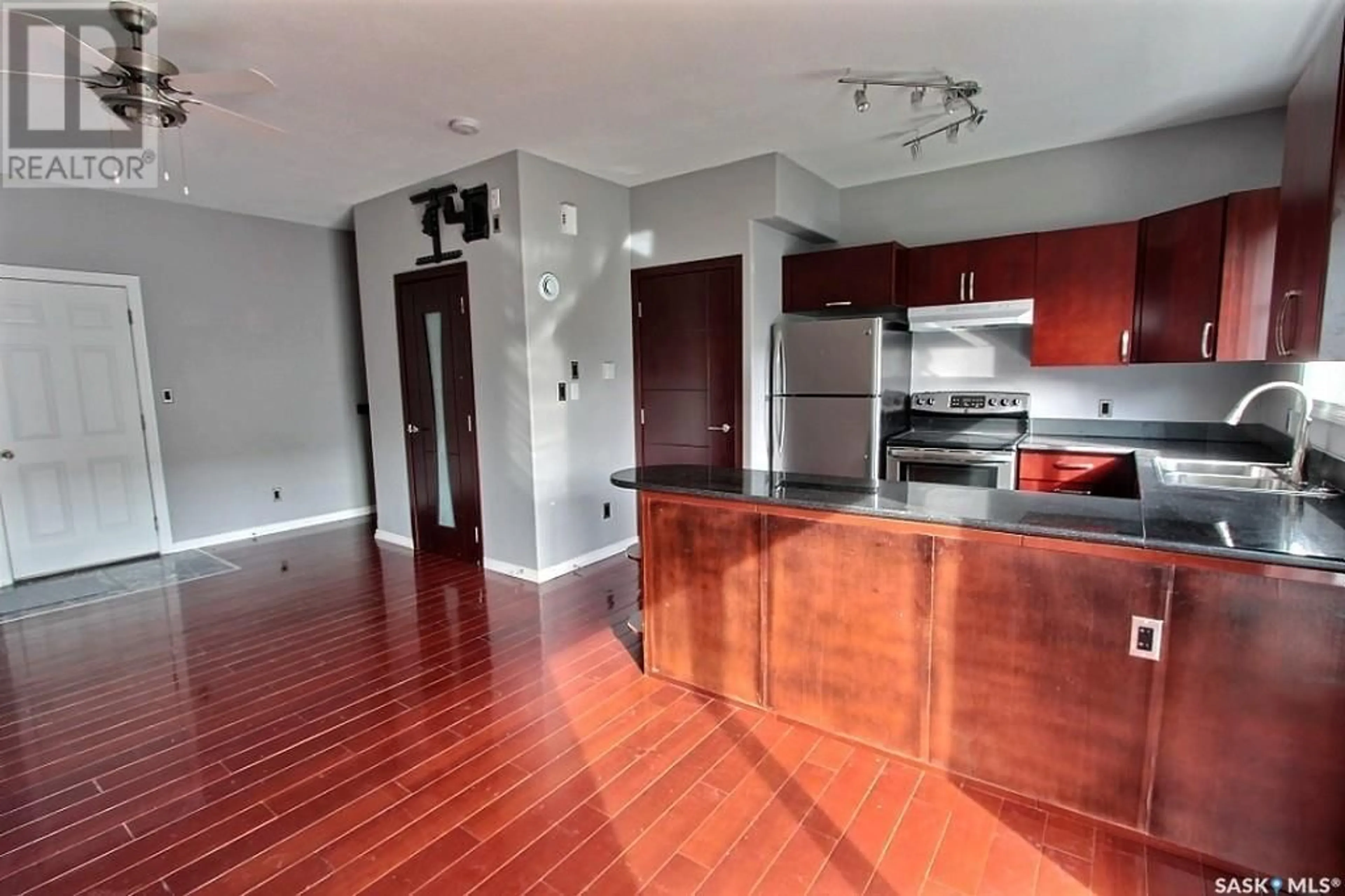 Open concept kitchen, wood/laminate floor for 201 10TH STREET, Prince Albert Saskatchewan S6V0Y8