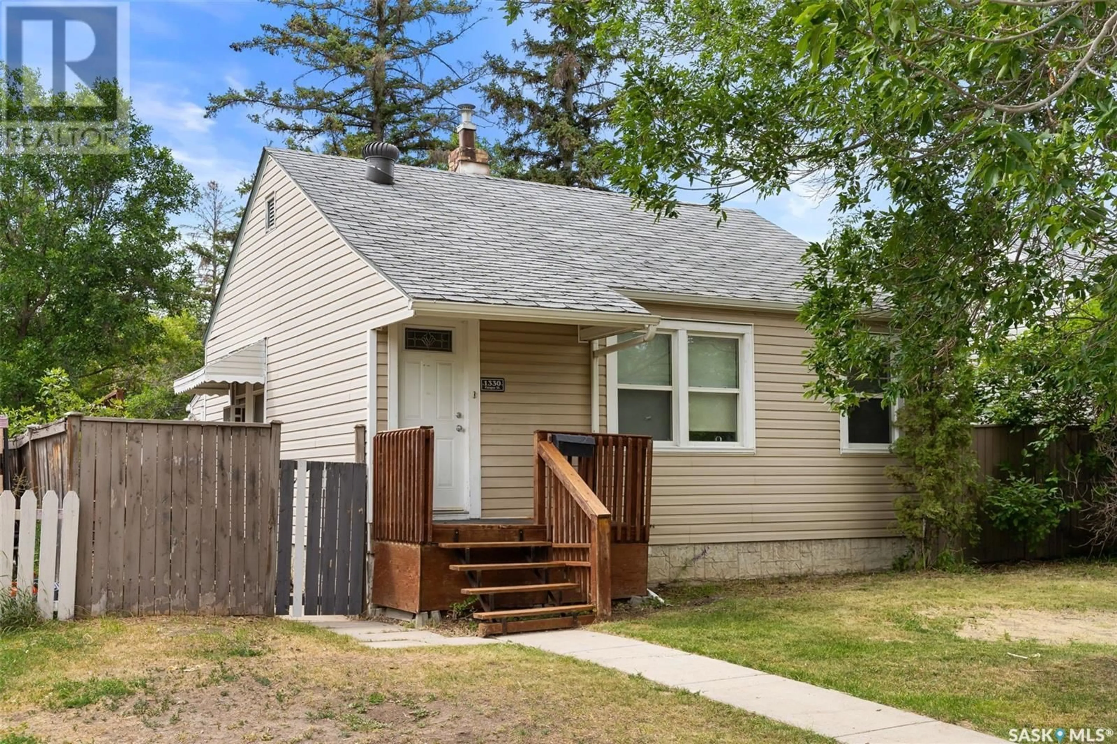 Home with vinyl exterior material, street for 1330 PASQUA STREET, Regina Saskatchewan S4T4L4