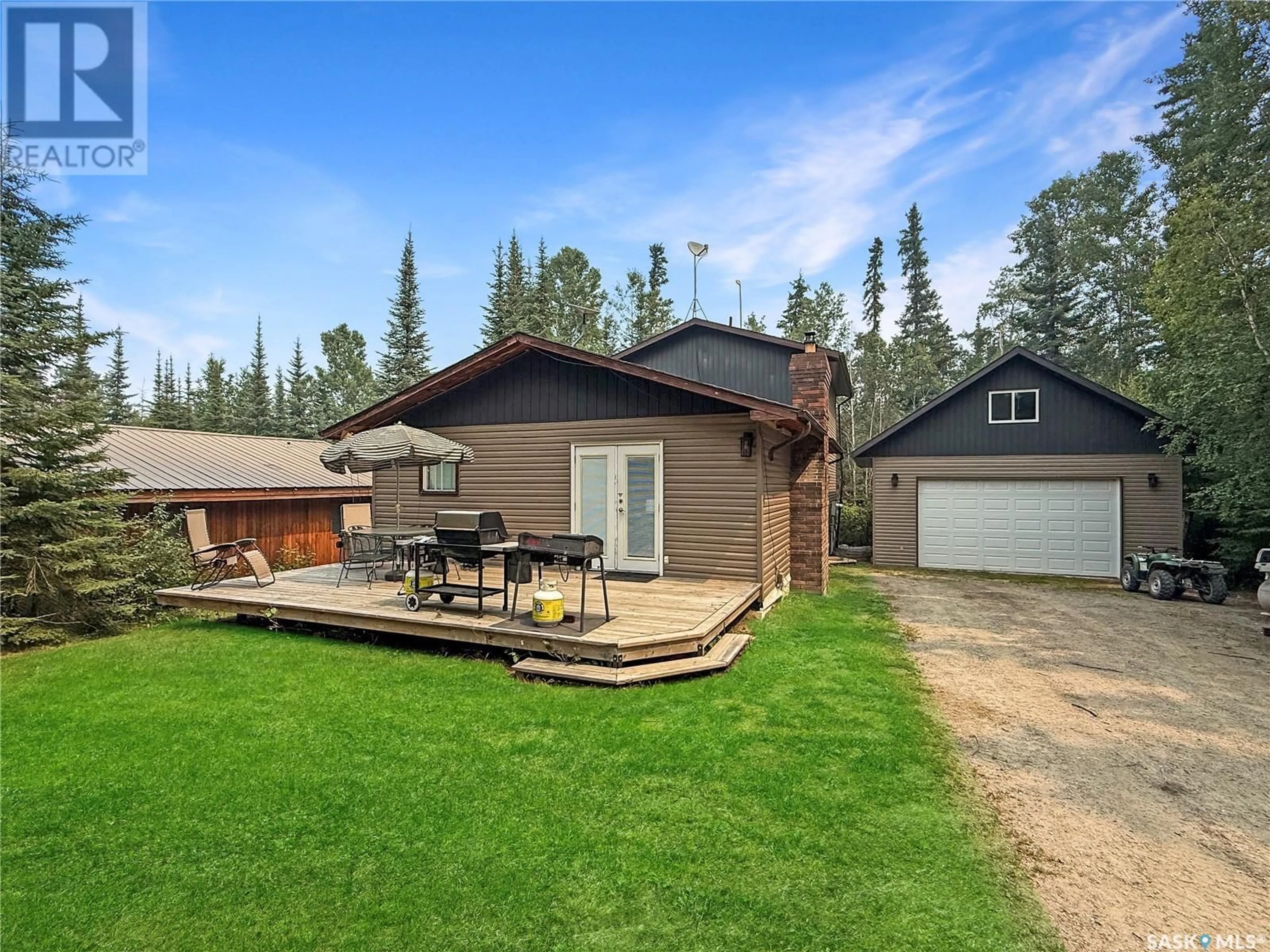 A pic from outside/outdoor area/front of a property/back of a property/a pic from drone, unknown for 509 ASPEN CRESCENT, White Swan Lake Saskatchewan S0J1T0