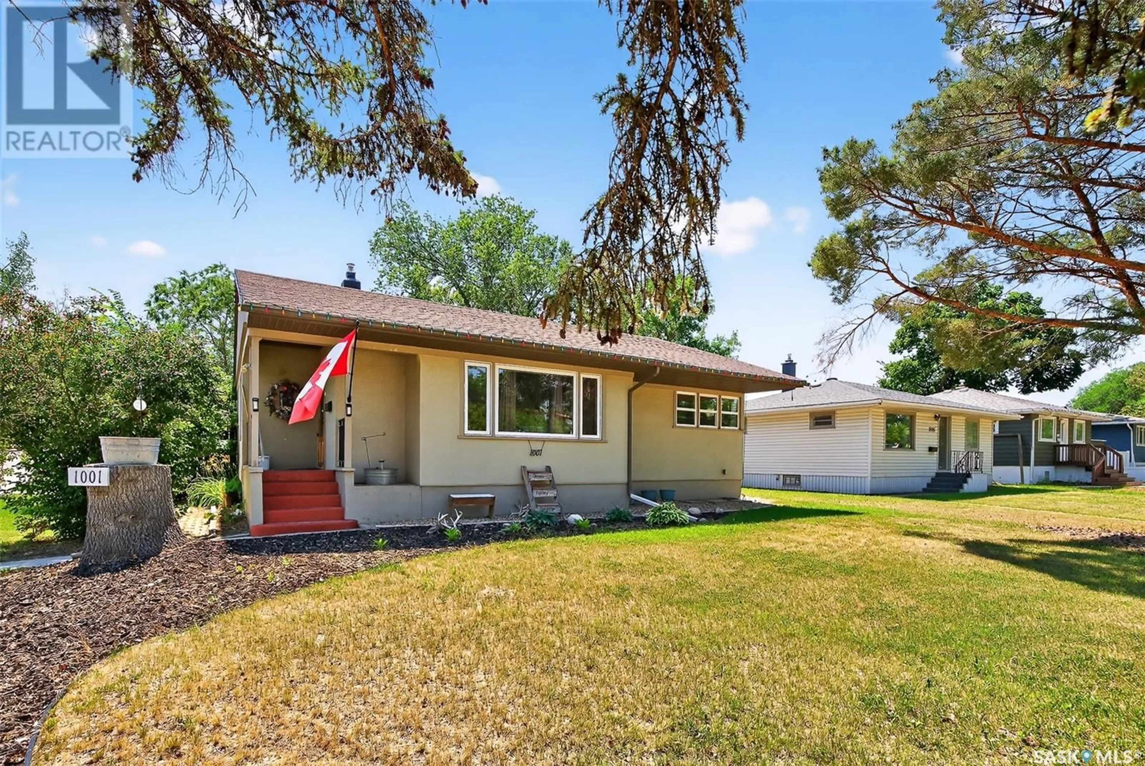 Home with vinyl exterior material, street for 1001 COTEAU STREET, Moose Jaw Saskatchewan S6H5G3