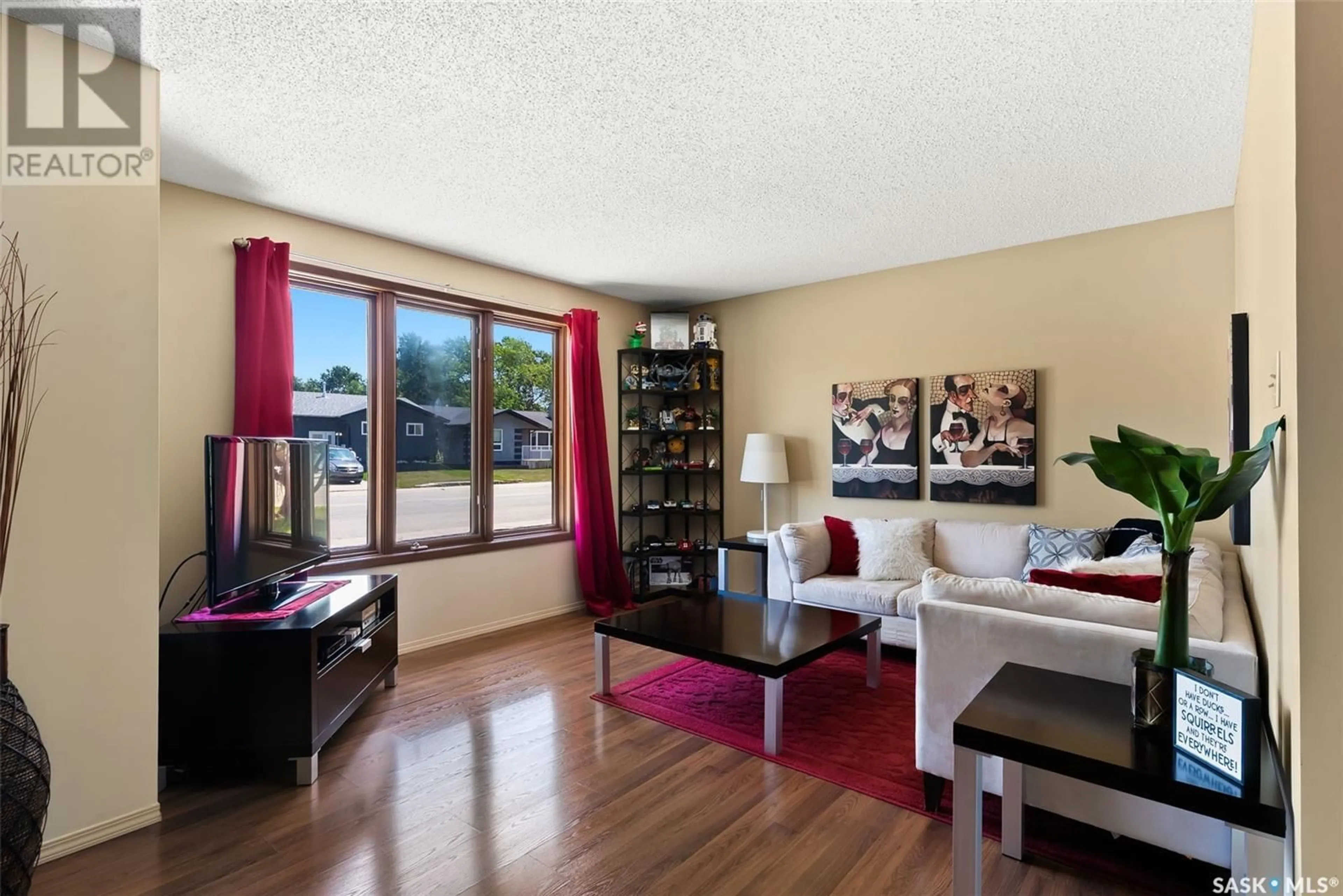 Living room with furniture, wood/laminate floor for 1618 FLEET STREET, Regina Saskatchewan S4N5S3