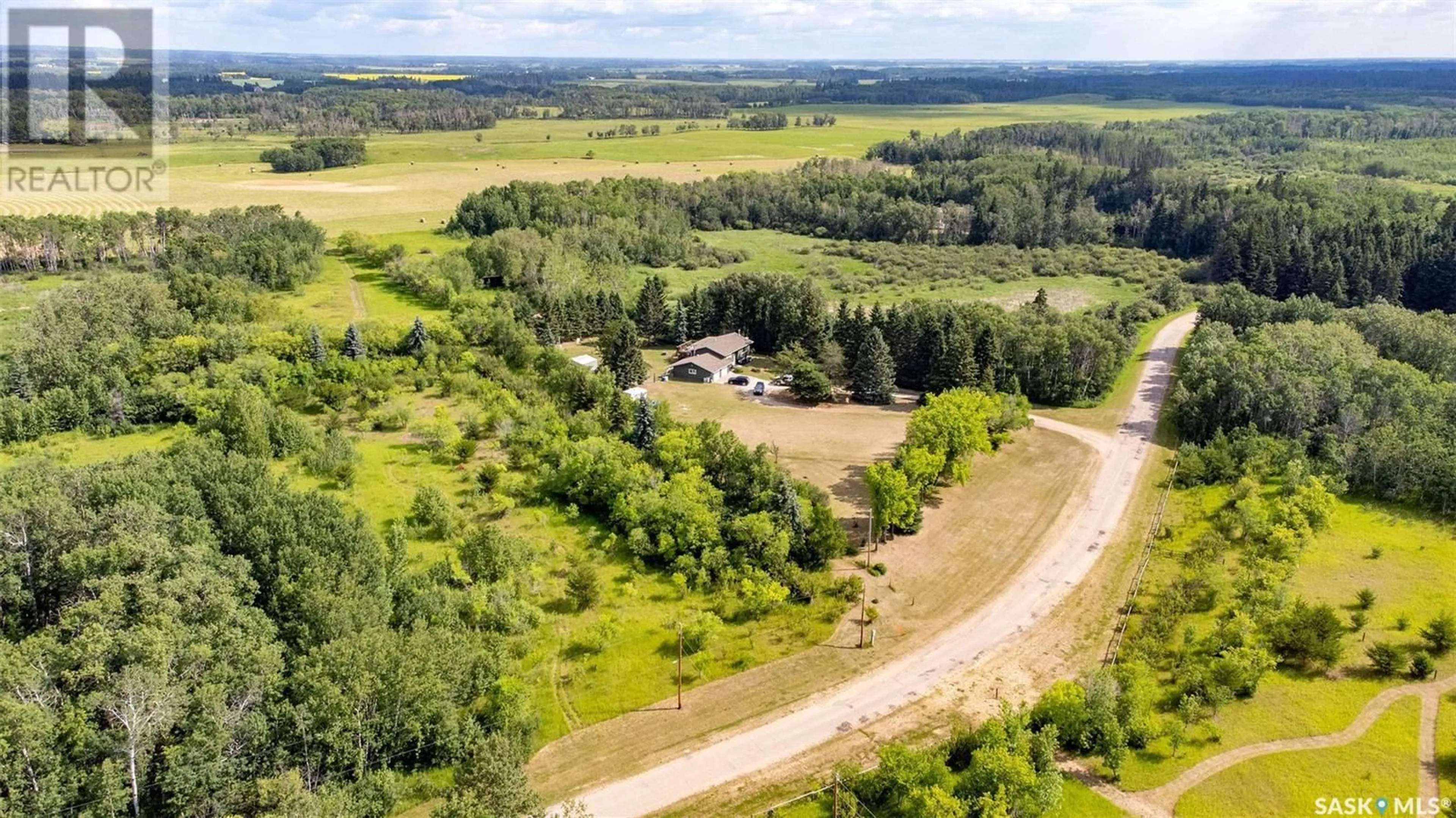 A pic from outside/outdoor area/front of a property/back of a property/a pic from drone, forest/trees view for 815 FORSEILLE DRIVE, Buckland Rm No. 491 Saskatchewan S6V5R3