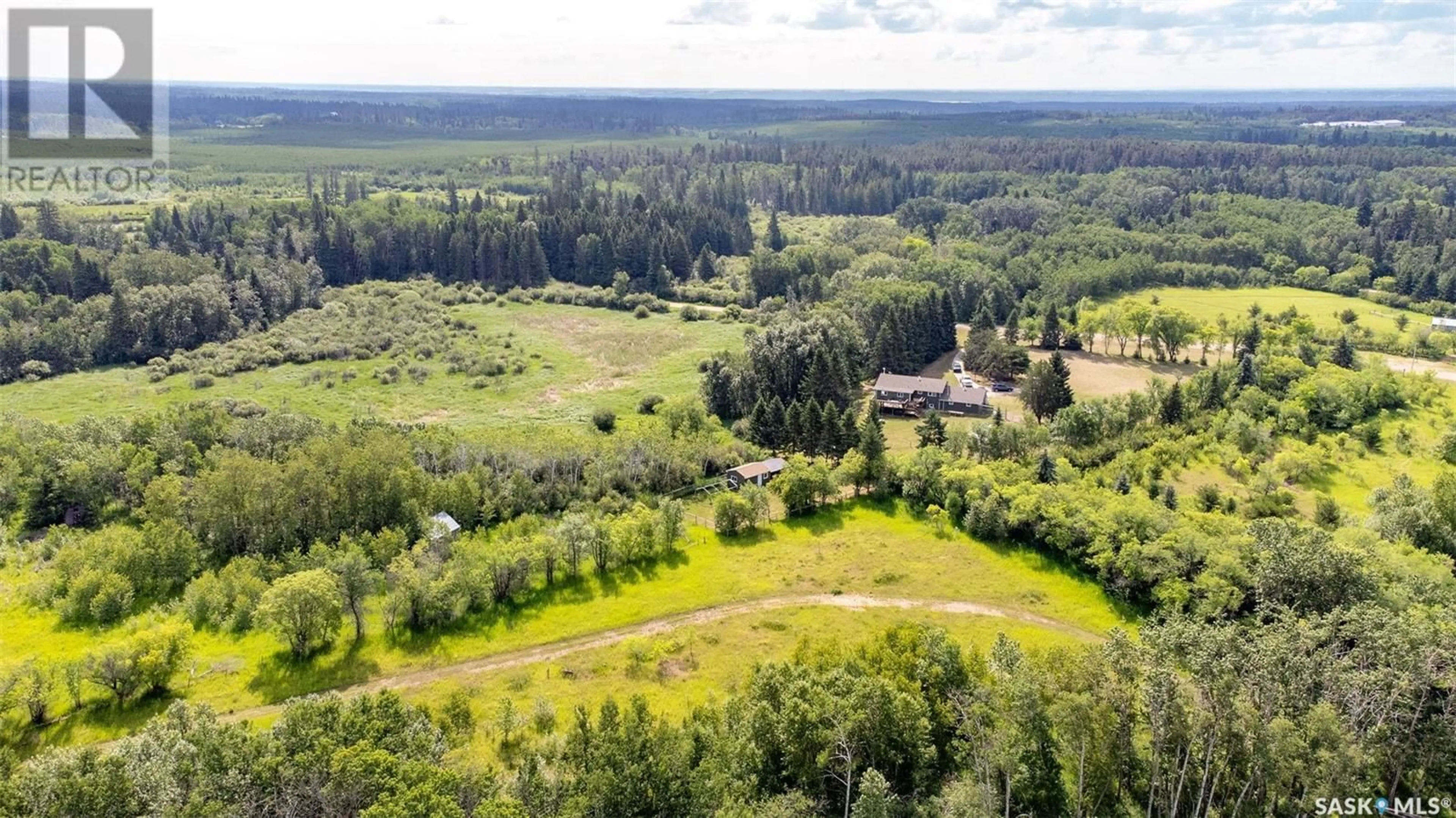 A pic from outside/outdoor area/front of a property/back of a property/a pic from drone, forest/trees view for 815 FORSEILLE DRIVE, Buckland Rm No. 491 Saskatchewan S6V5R3