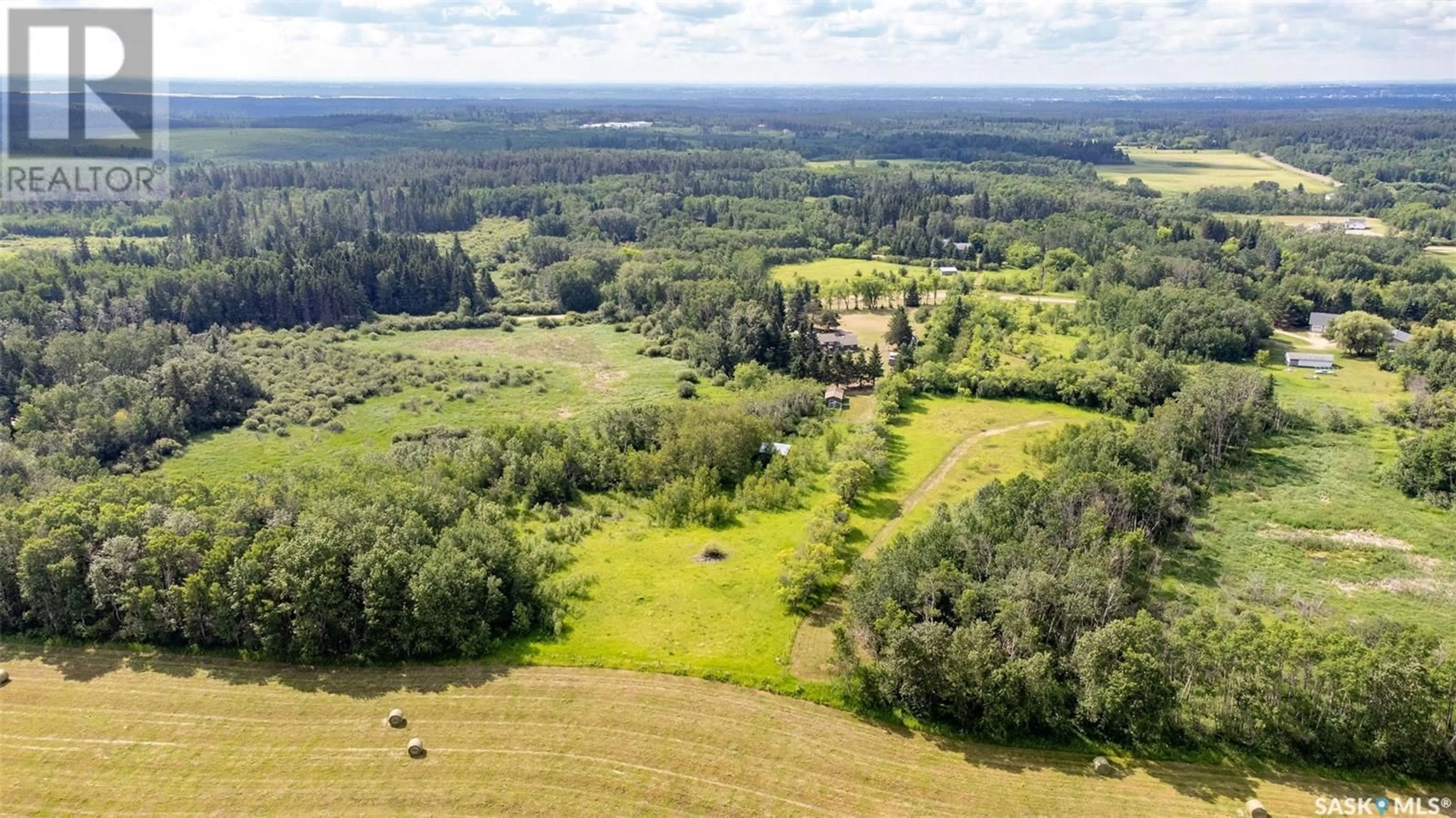 A pic from outside/outdoor area/front of a property/back of a property/a pic from drone, forest/trees view for 815 FORSEILLE DRIVE, Buckland Rm No. 491 Saskatchewan S6V5R3