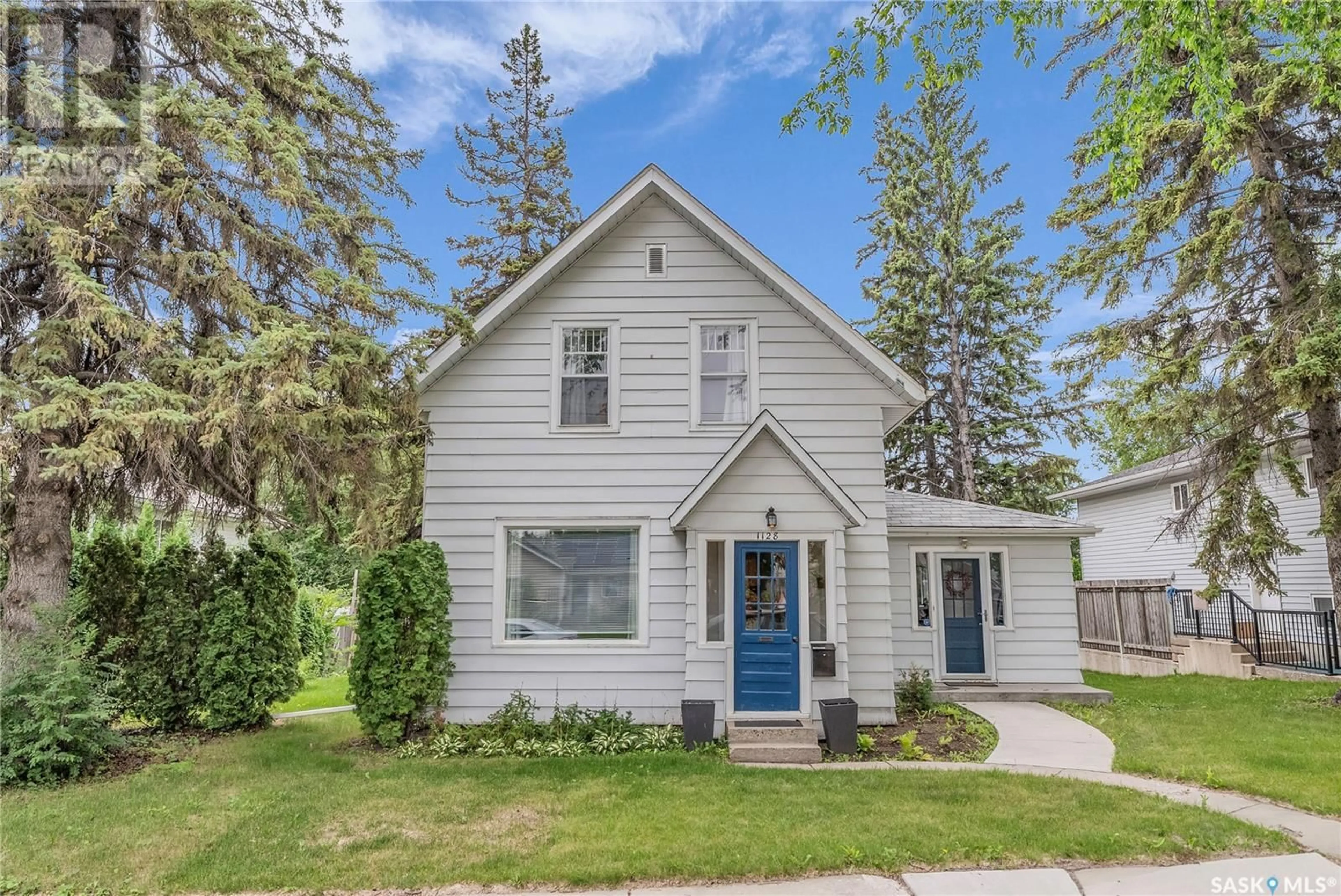 Home with vinyl exterior material, street for 1128 12TH STREET, Saskatoon Saskatchewan S7H0G2