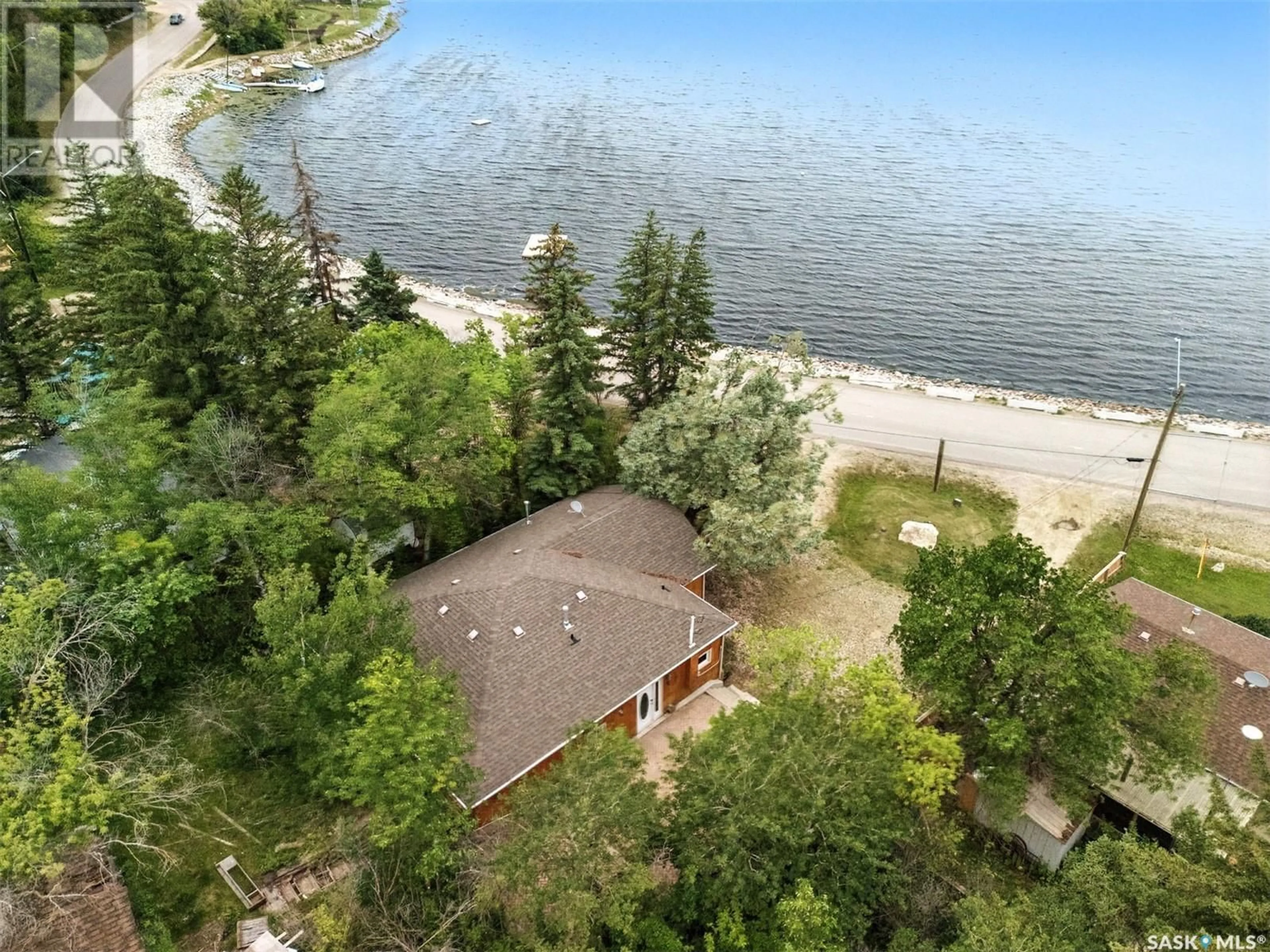 A pic from outside/outdoor area/front of a property/back of a property/a pic from drone, water/lake/river/ocean view for 306 LAKE AVENUE, Manitou Beach Saskatchewan S0K4T1