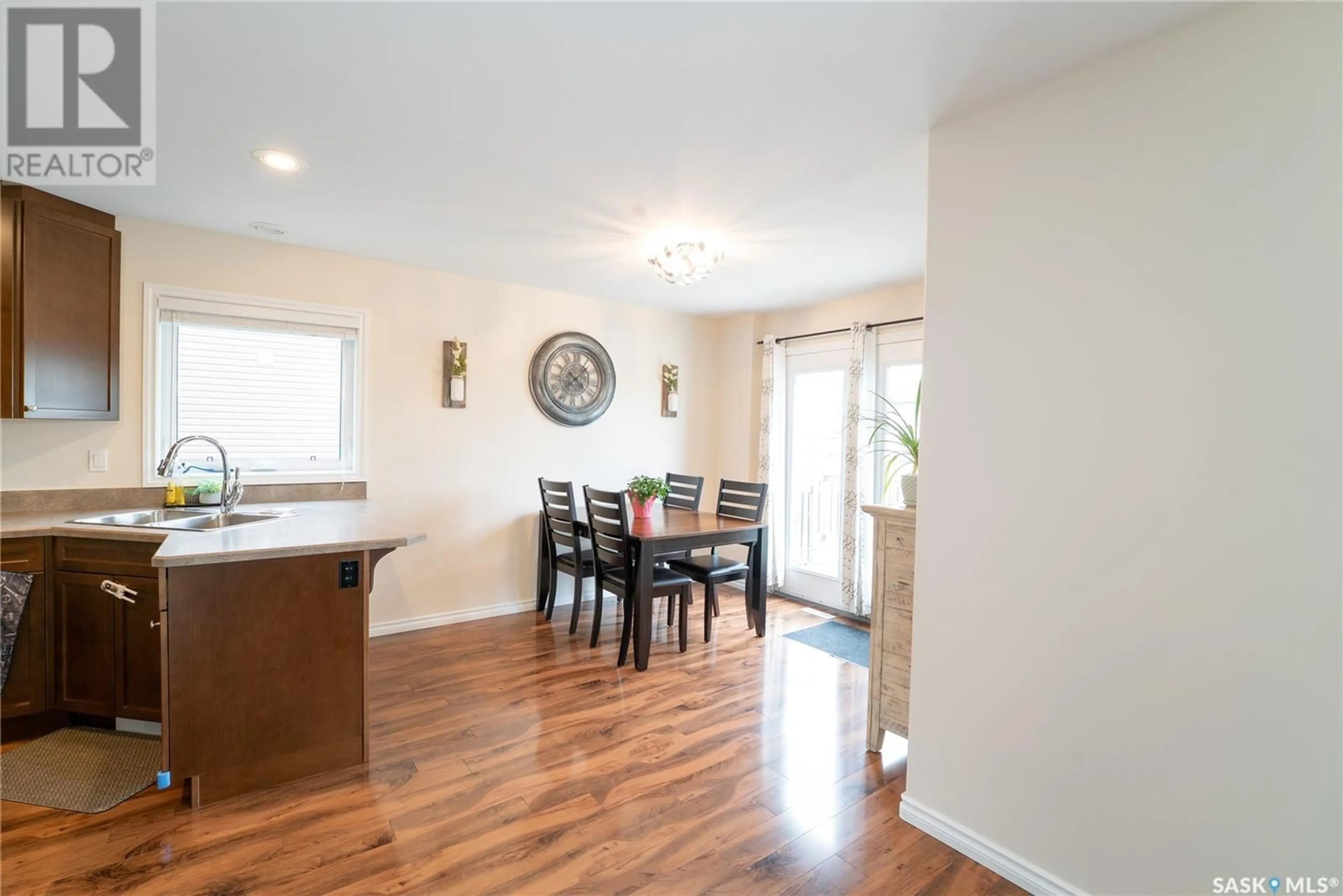 Dining room, wood/laminate floor for 410 LEHRER MANOR, Saskatoon Saskatchewan S7R0L3