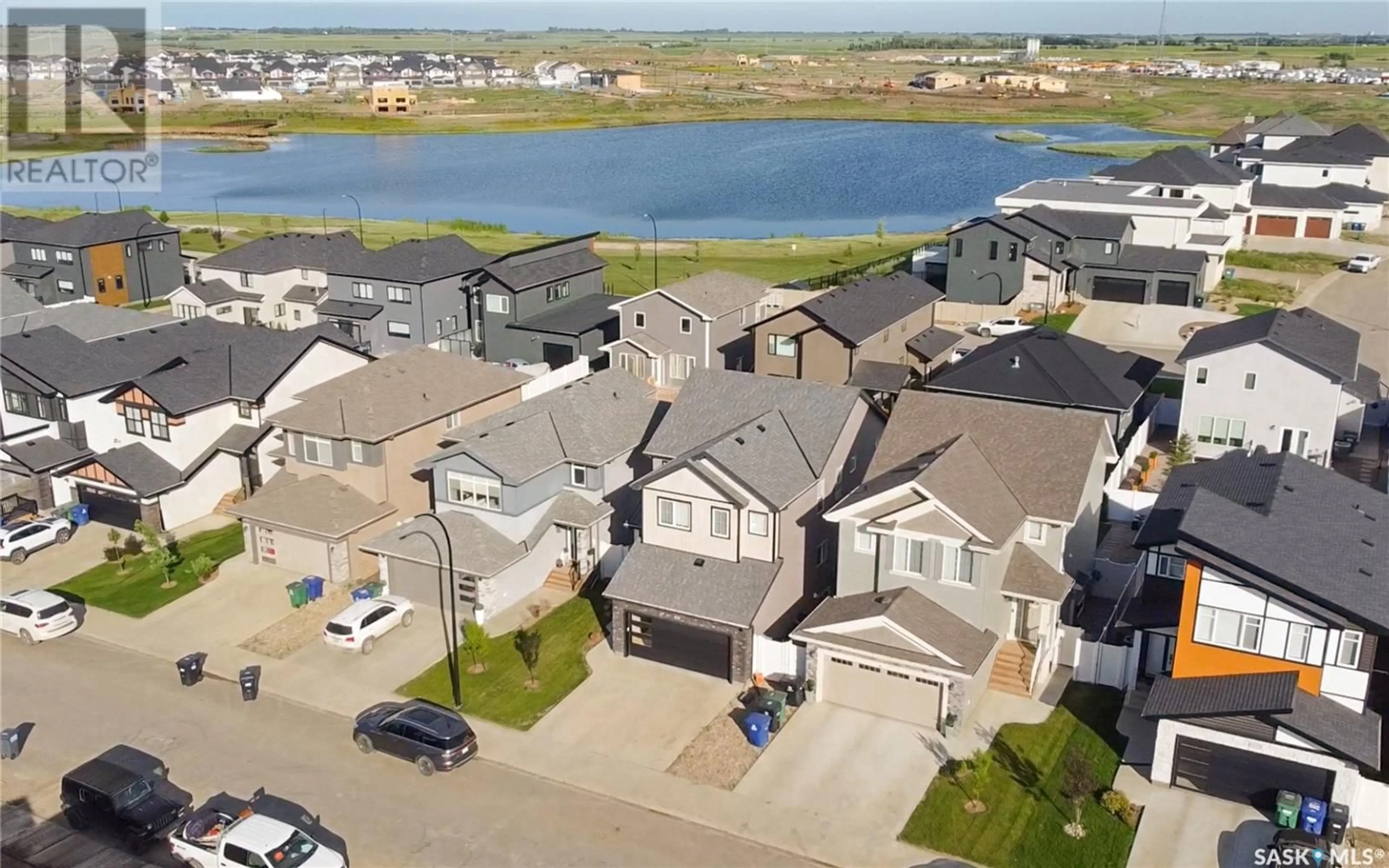 A pic from outside/outdoor area/front of a property/back of a property/a pic from drone, water/lake/river/ocean view for 454 ANISKOTAW WAY, Saskatoon Saskatchewan S7V1M3