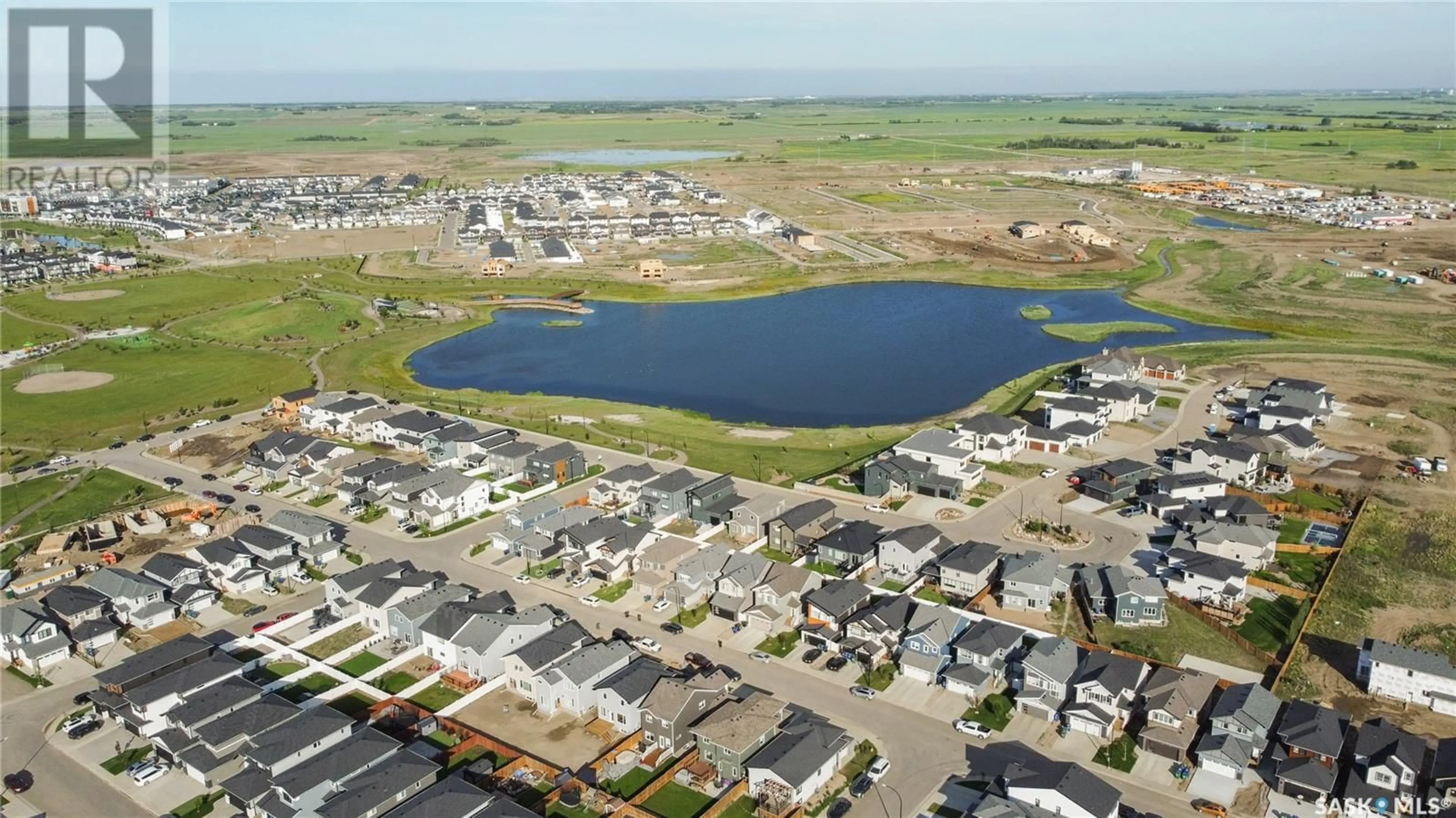 A pic from outside/outdoor area/front of a property/back of a property/a pic from drone, water/lake/river/ocean view for 454 ANISKOTAW WAY, Saskatoon Saskatchewan S7V1M3