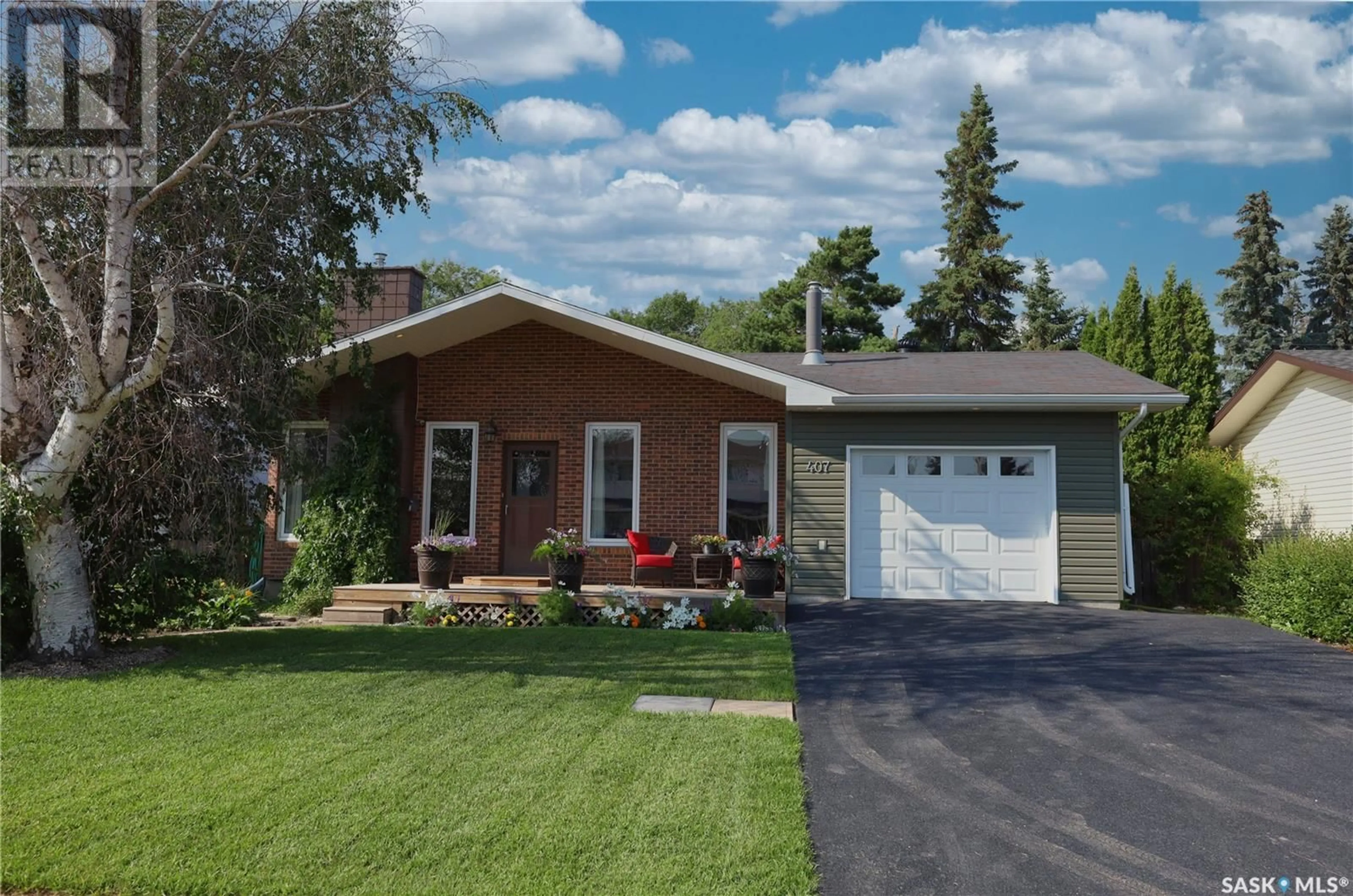 Home with brick exterior material, street for 407 3RD STREET, Langham Saskatchewan S0K2L0