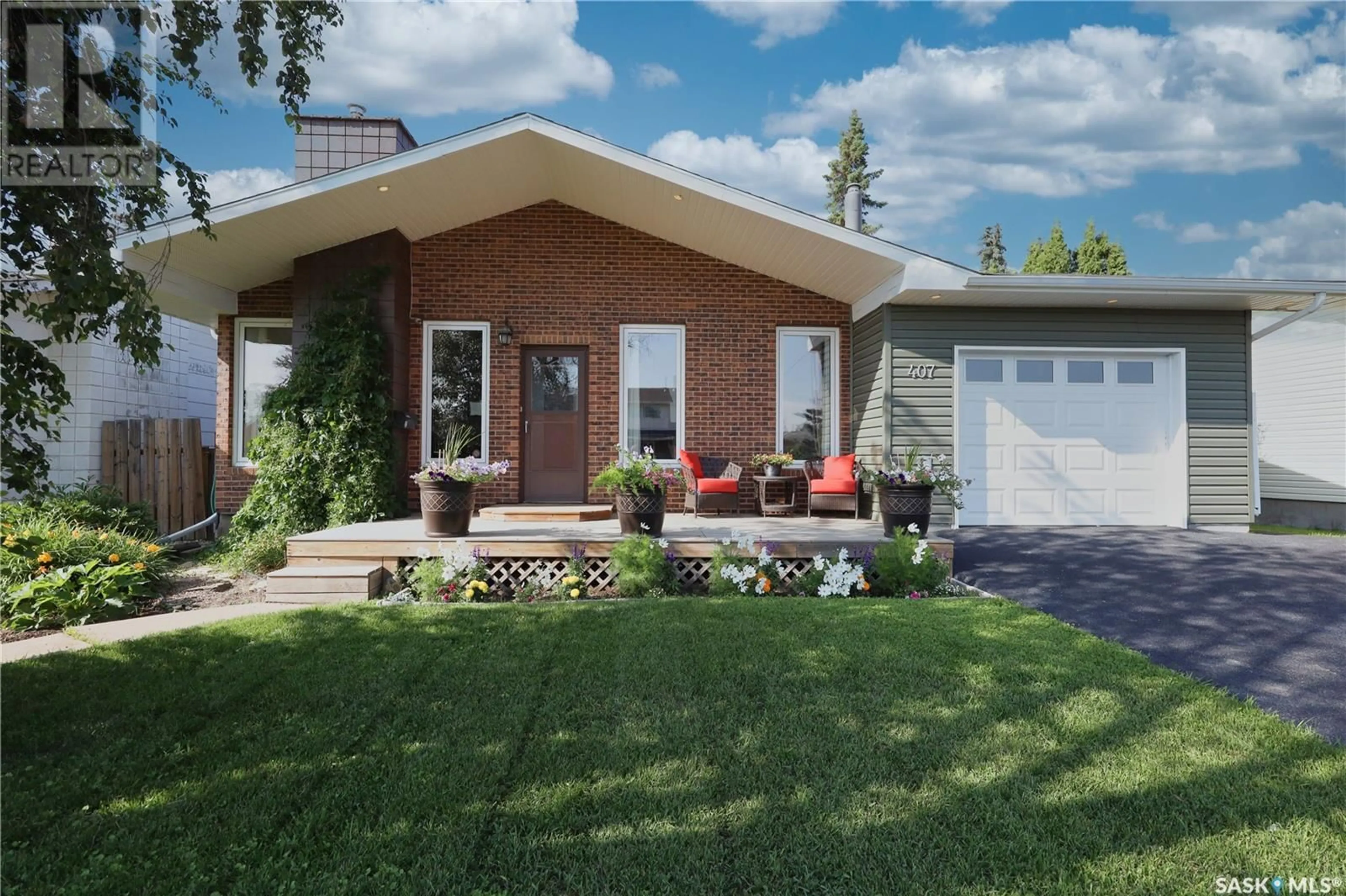 Home with brick exterior material, street for 407 3RD STREET, Langham Saskatchewan S0K2L0