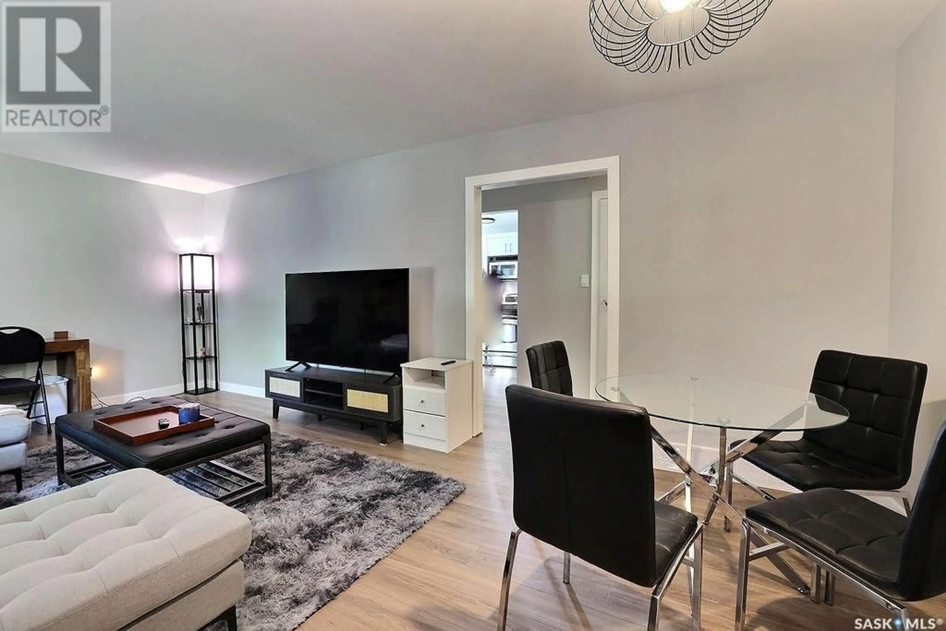 Living room with furniture, wood/laminate floor for 509 18TH AVENUE, Regina Saskatchewan S4N1E5