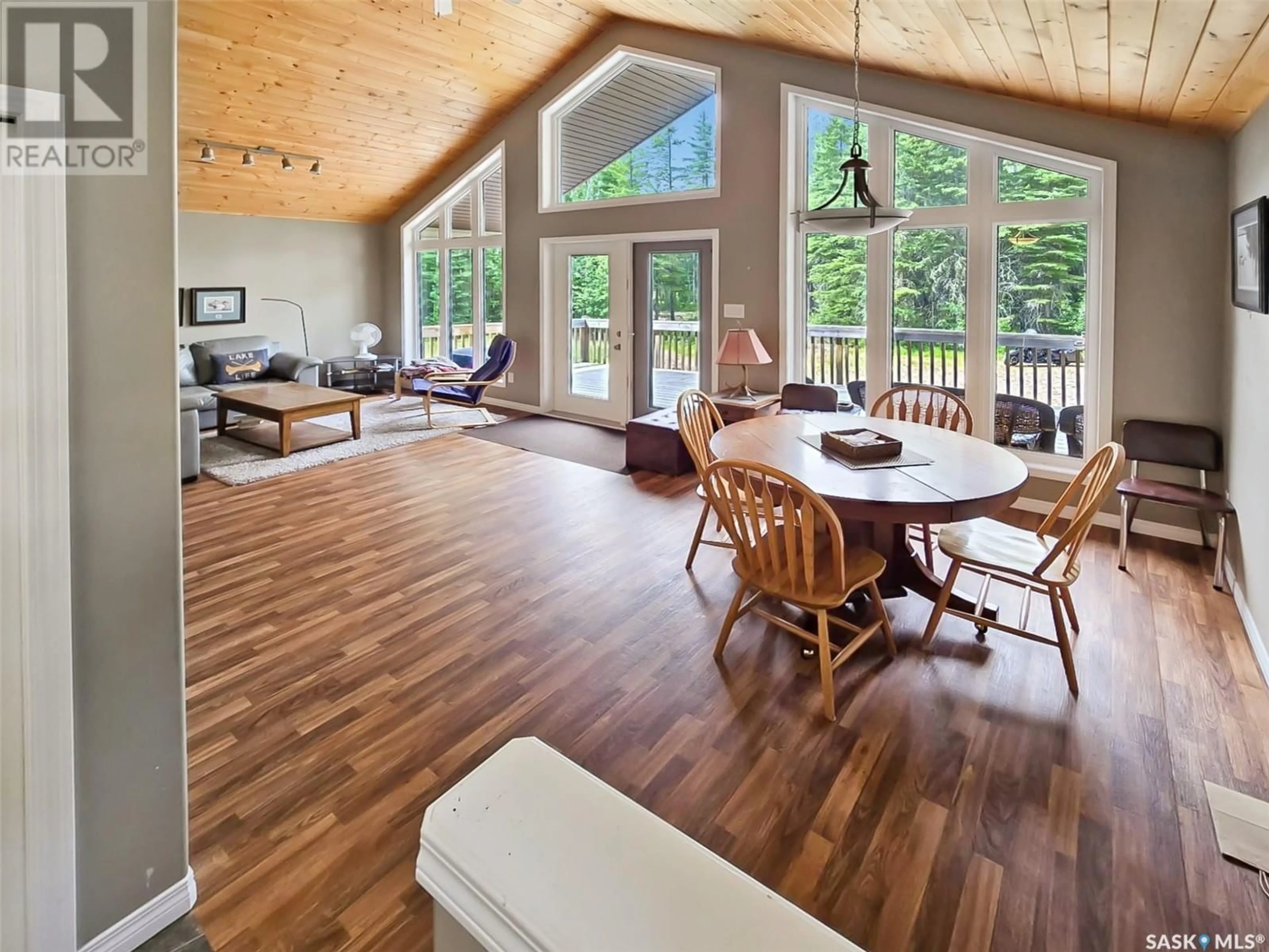 Living room with furniture, wood/laminate floor for 409 MEADOW RIDGE DRIVE, Candle Lake Saskatchewan S0J3E0