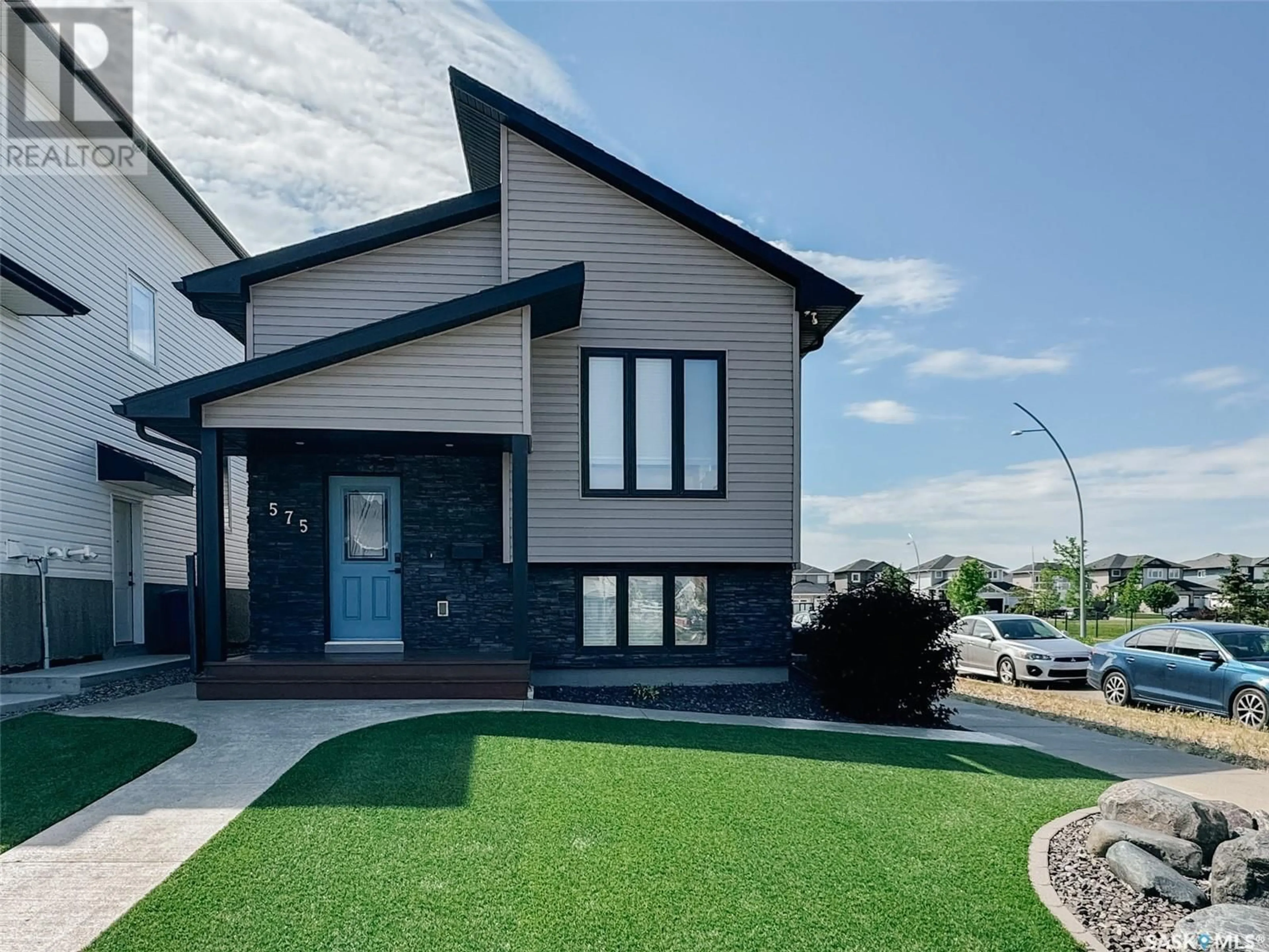 Home with vinyl exterior material, street for 575 MARLATTE LANE, Saskatoon Saskatchewan S7W0S8