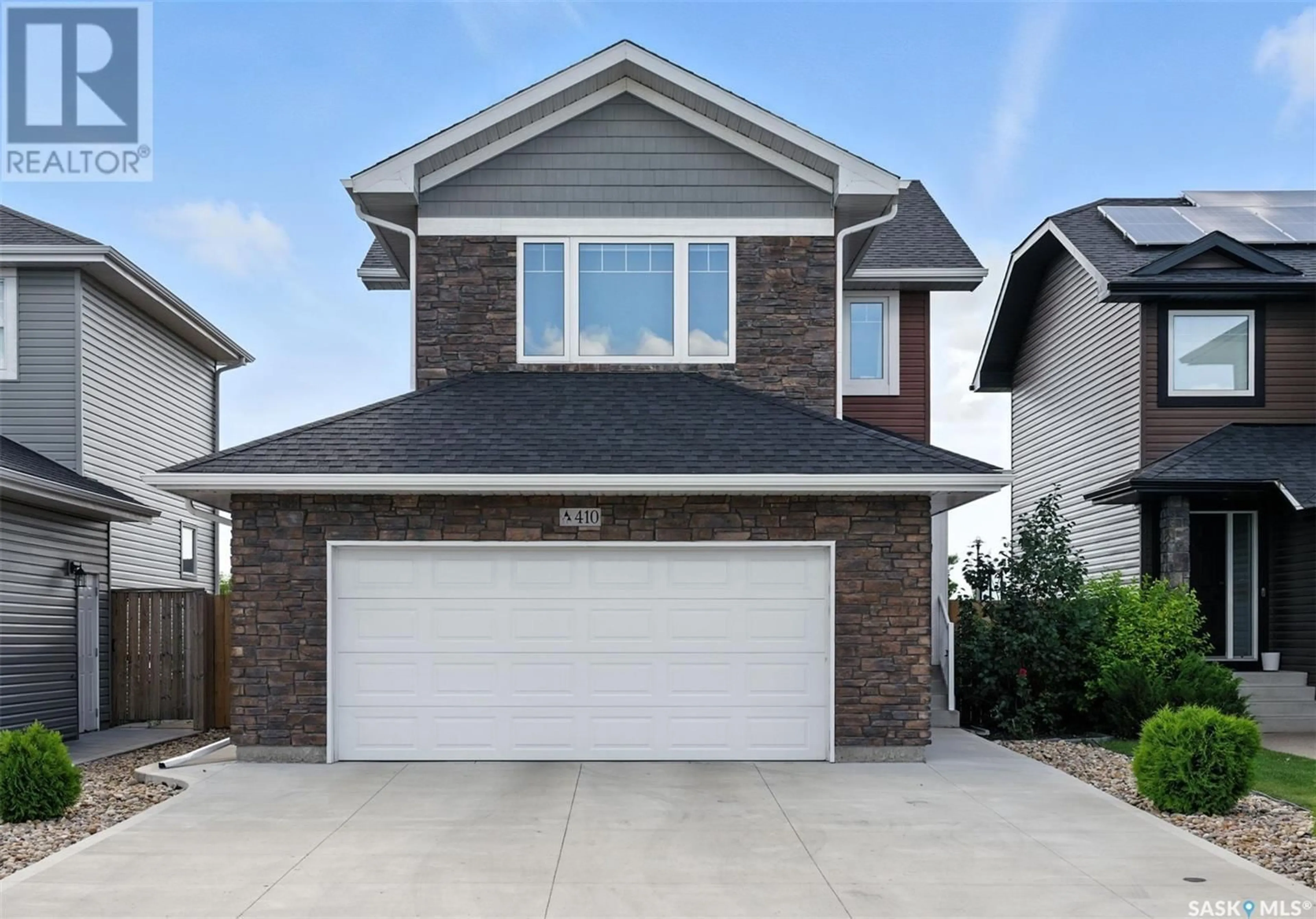 Home with vinyl exterior material, street for 410 KOLYNCHUK CRESCENT, Saskatoon Saskatchewan S7T0W4