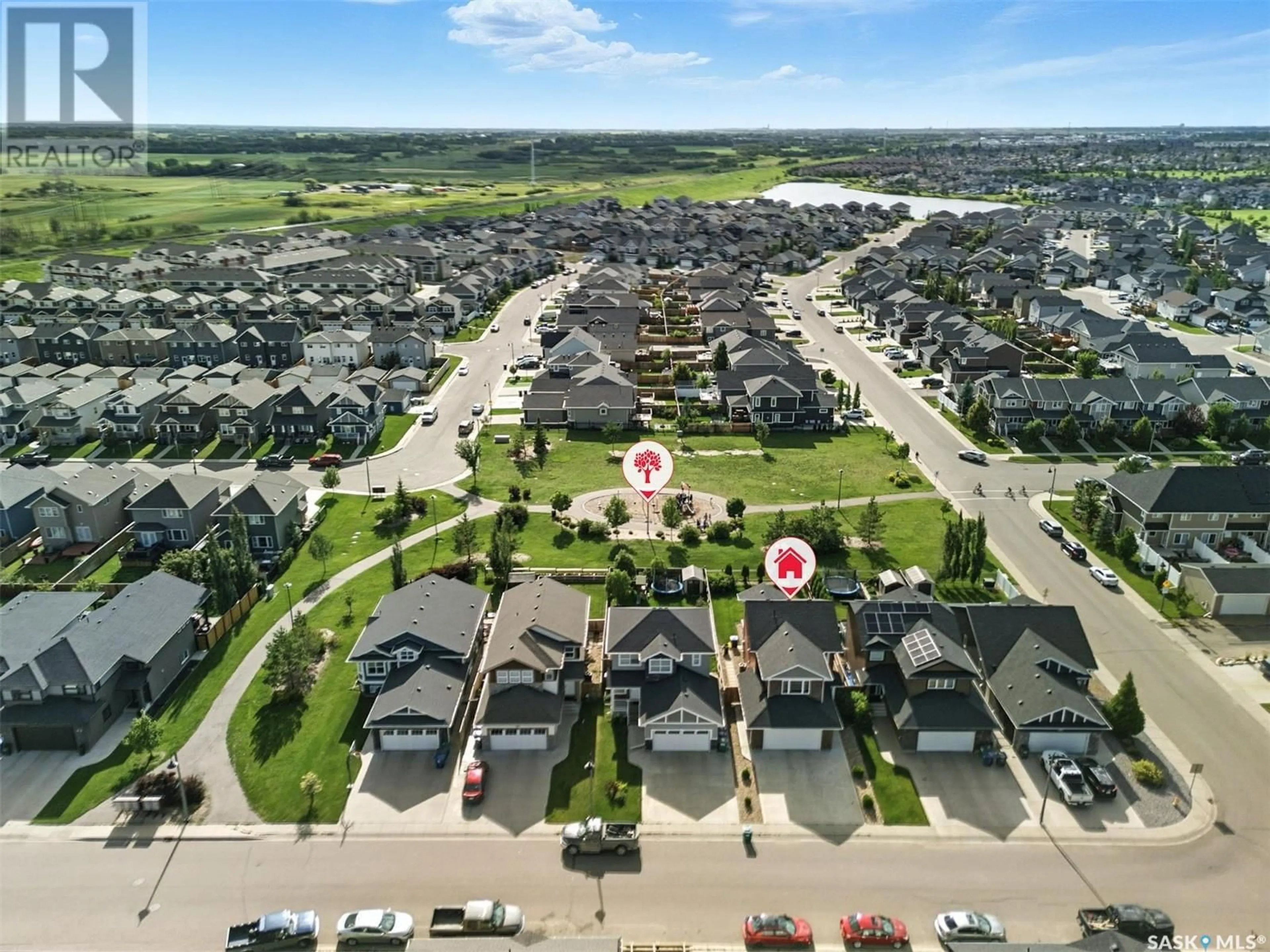A pic from outside/outdoor area/front of a property/back of a property/a pic from drone, water/lake/river/ocean view for 410 KOLYNCHUK CRESCENT, Saskatoon Saskatchewan S7T0W4