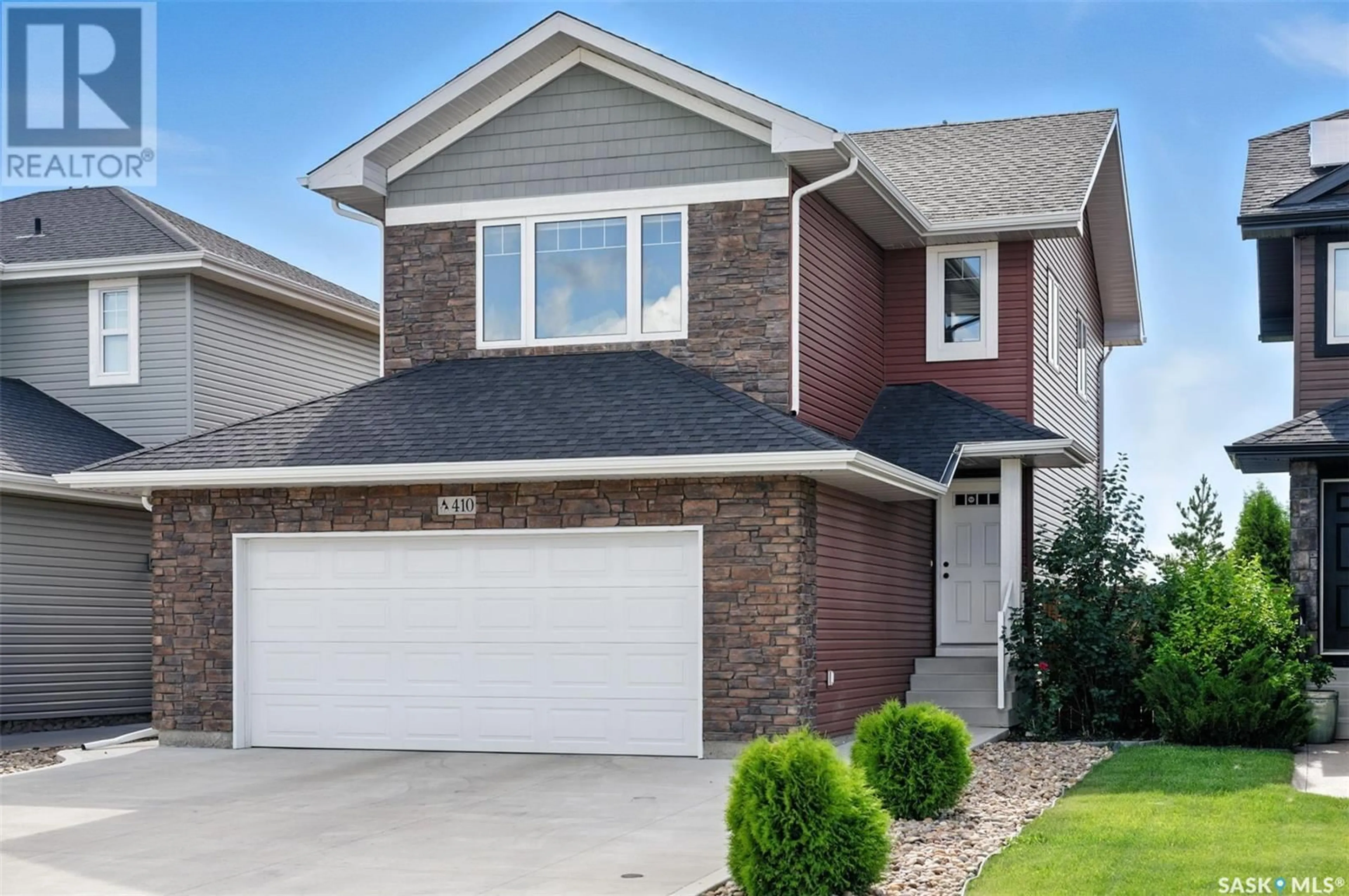 Home with vinyl exterior material, street for 410 KOLYNCHUK CRESCENT, Saskatoon Saskatchewan S7T0W4