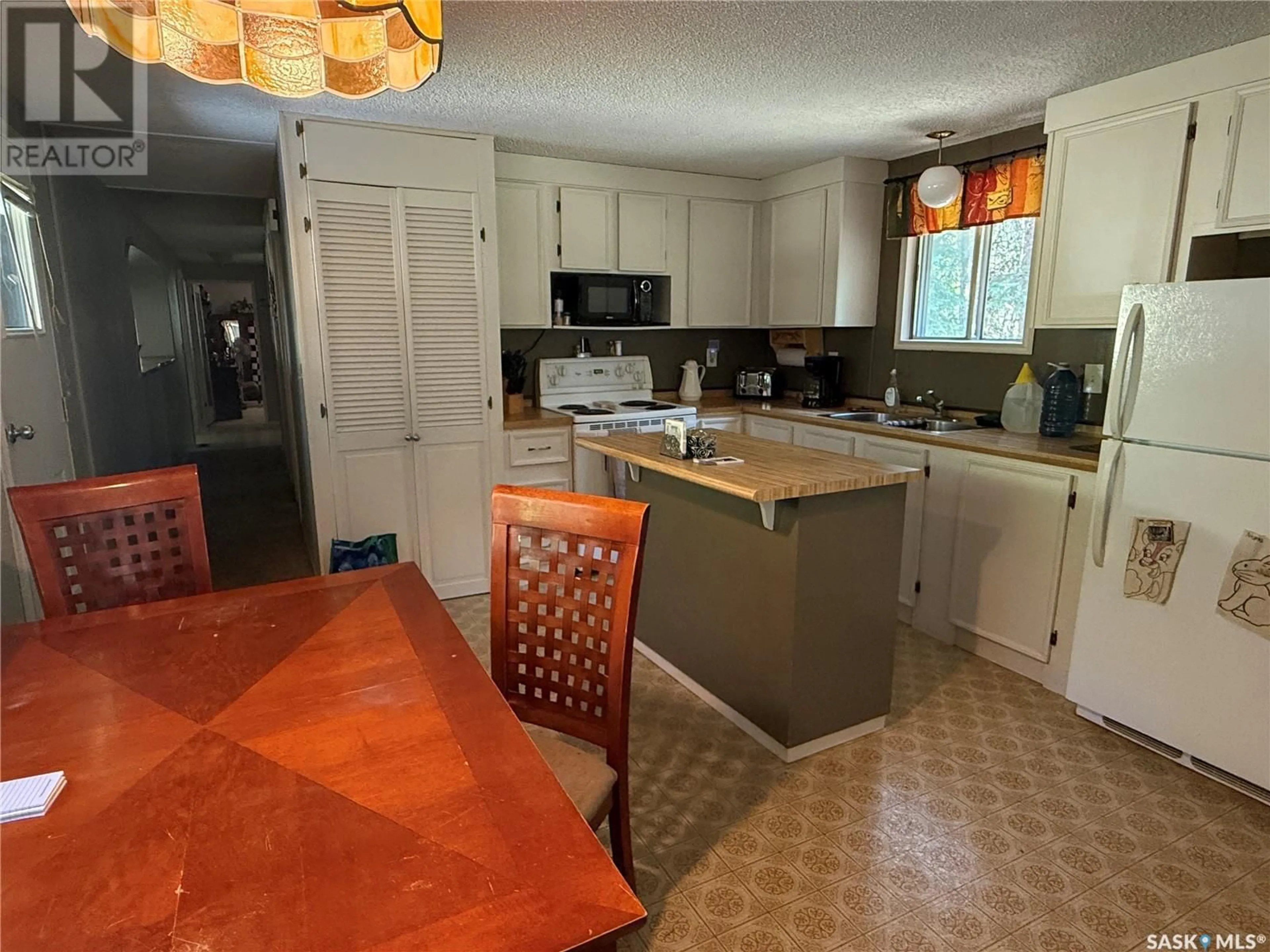 Open concept kitchen, ceramic/tile floor for KERR ACREAGE, Paddockwood Rm No. 520 Saskatchewan S0J3E0