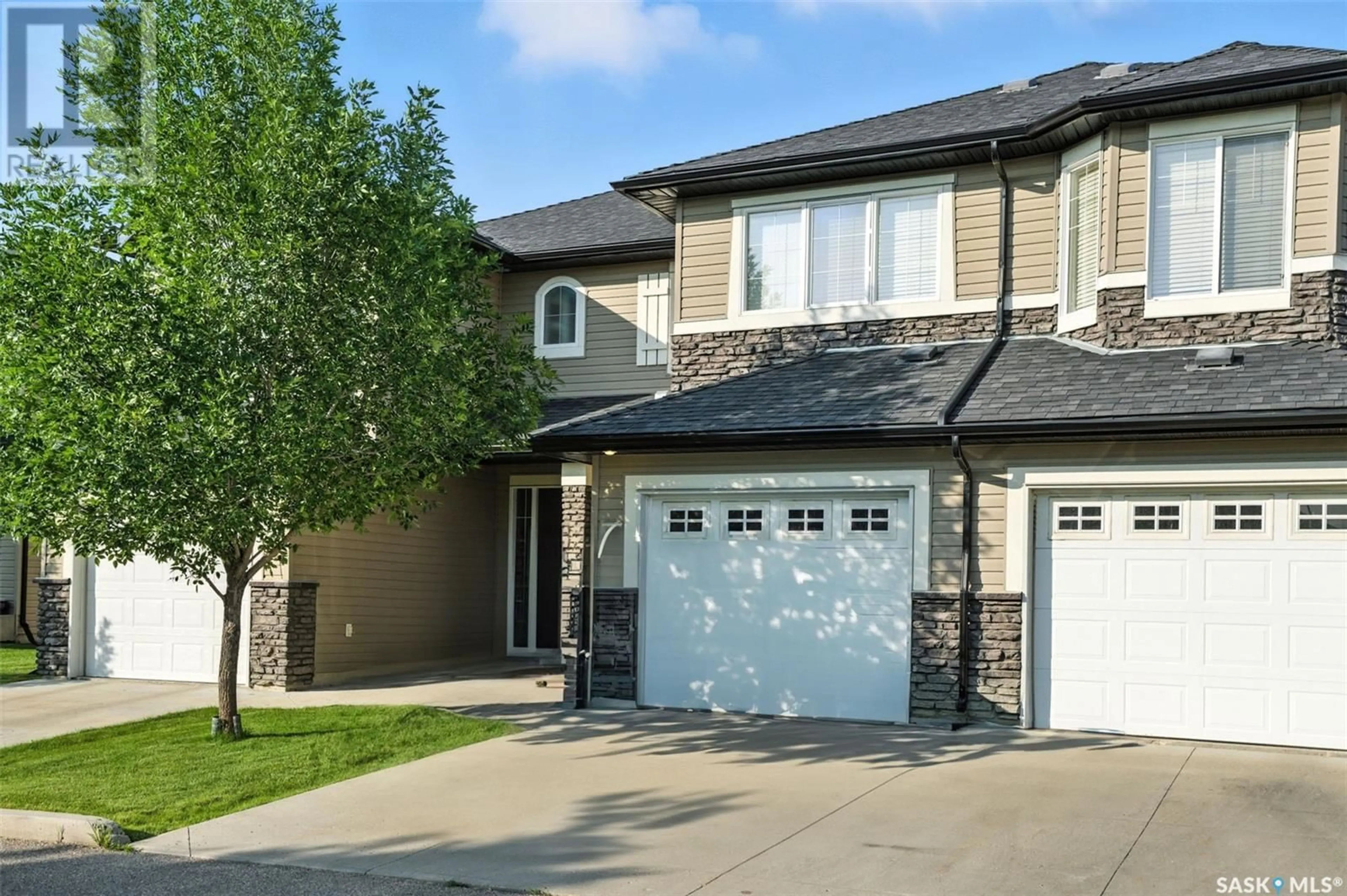 Home with brick exterior material, street for 410 - 304 LEDINGHAM WAY, Saskatoon Saskatchewan S7V0C4