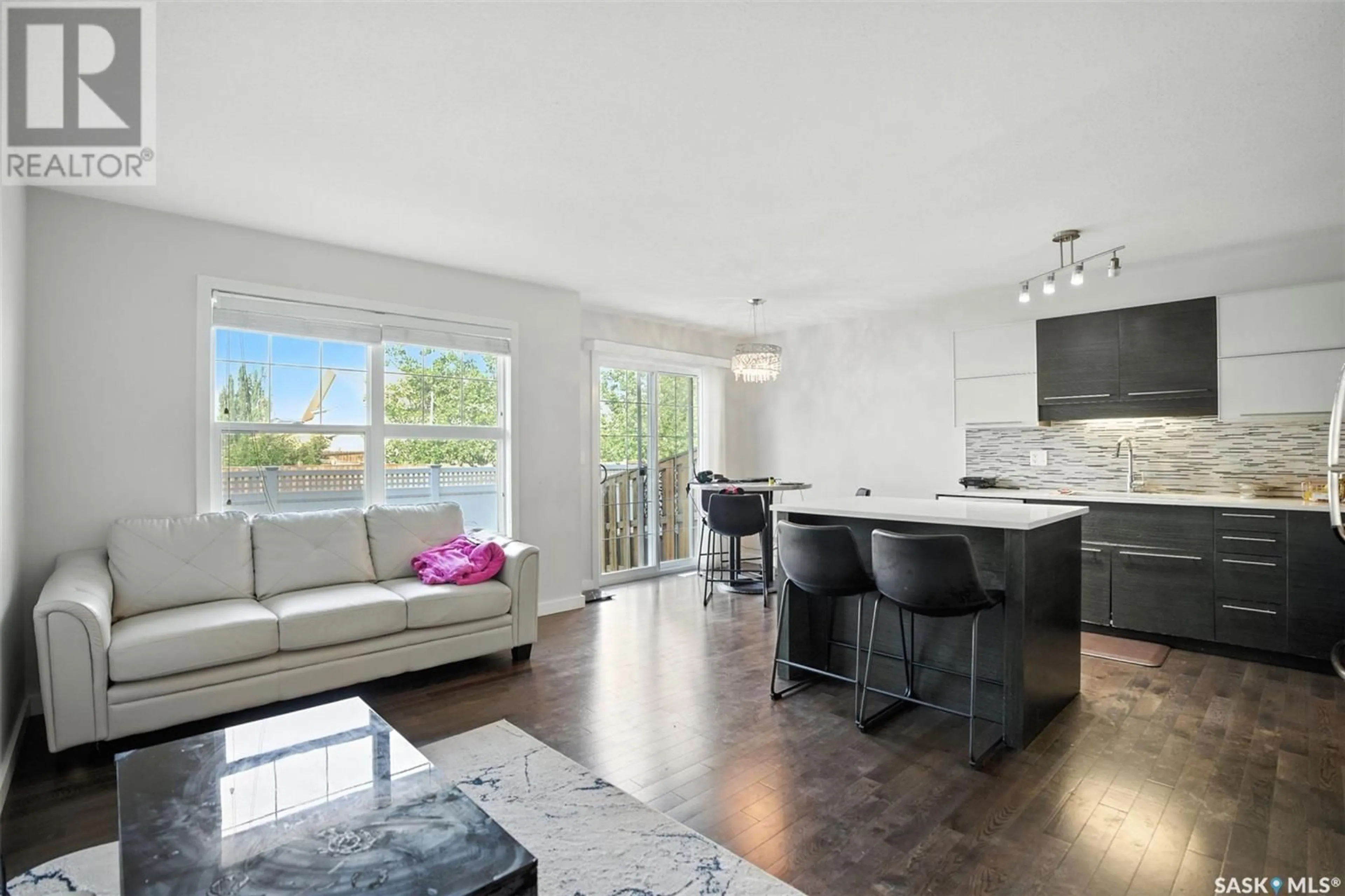 Open concept kitchen, wood/laminate floor for 410 - 304 LEDINGHAM WAY, Saskatoon Saskatchewan S7V0C4