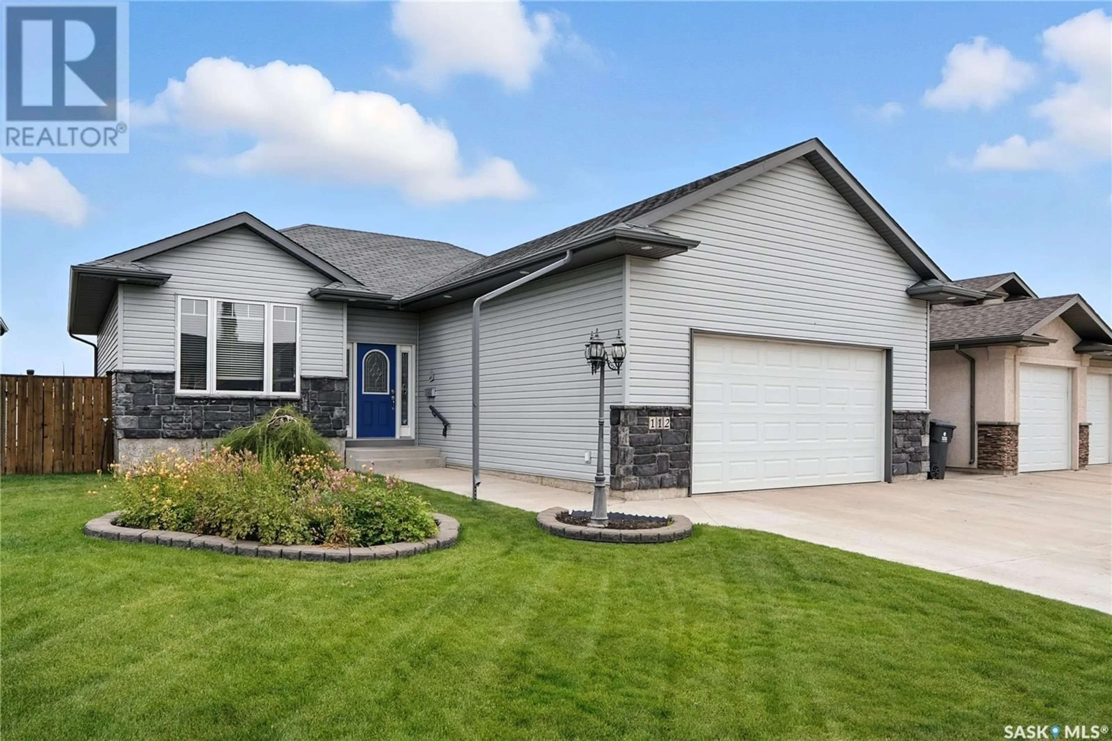 Home with vinyl exterior material, street for 112 EWLES PLACE, Martensville Saskatchewan S0K2T2